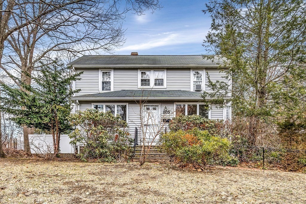 105 Hartford Street Natick, MA 01760 - Photo 1 of 41 a front view of a house with a garden