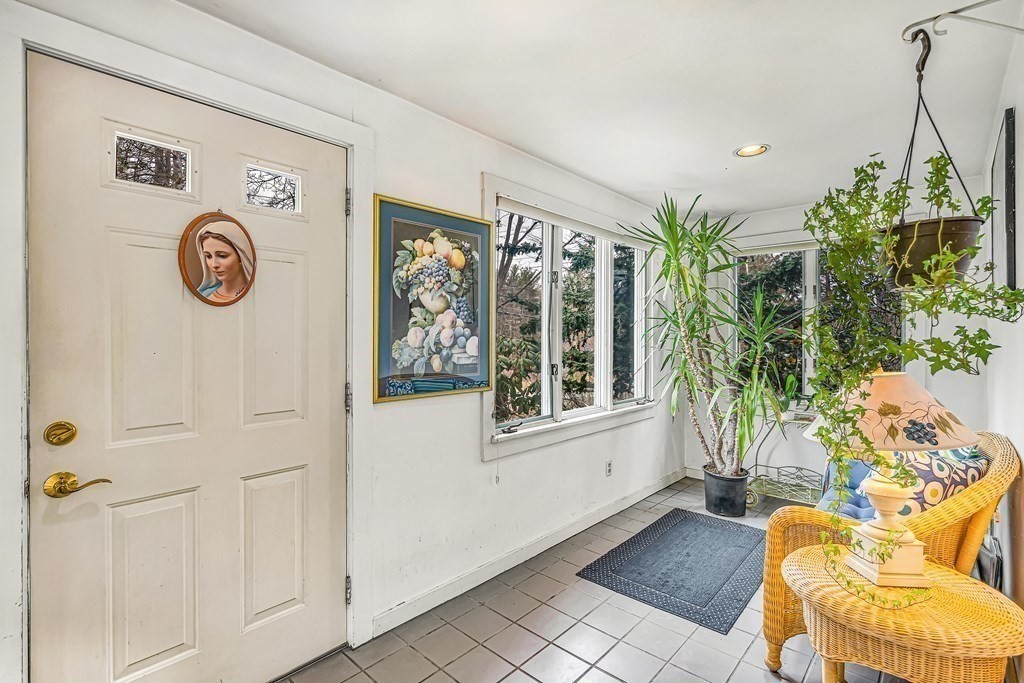 105 Hartford Street Natick, MA 01760 - Photo 11 of 41 a view of a entryway with furniture and garden view