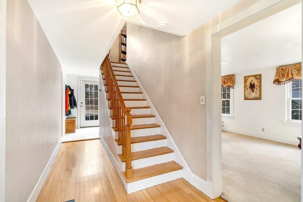 105 Hartford Street Natick, MA 01760 - Photo 13 of 41 a view of a hallway with wooden floor and entryway