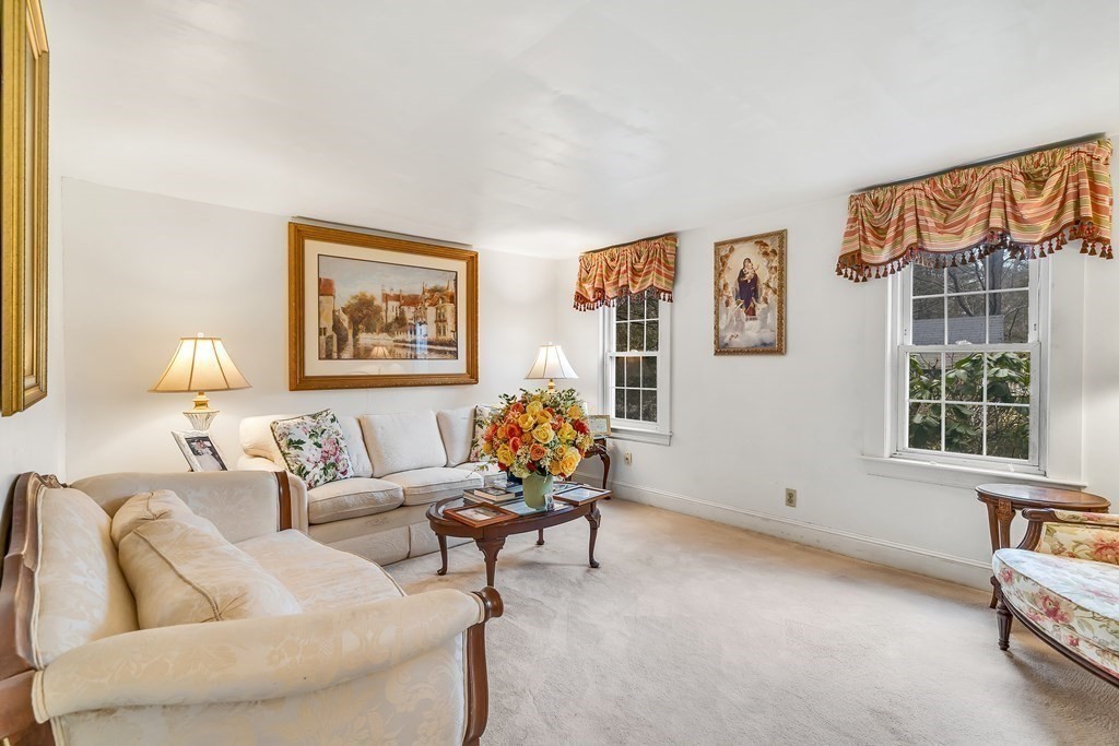 105 Hartford Street Natick, MA 01760 - Photo 14 of 41 a living room with furniture and a window