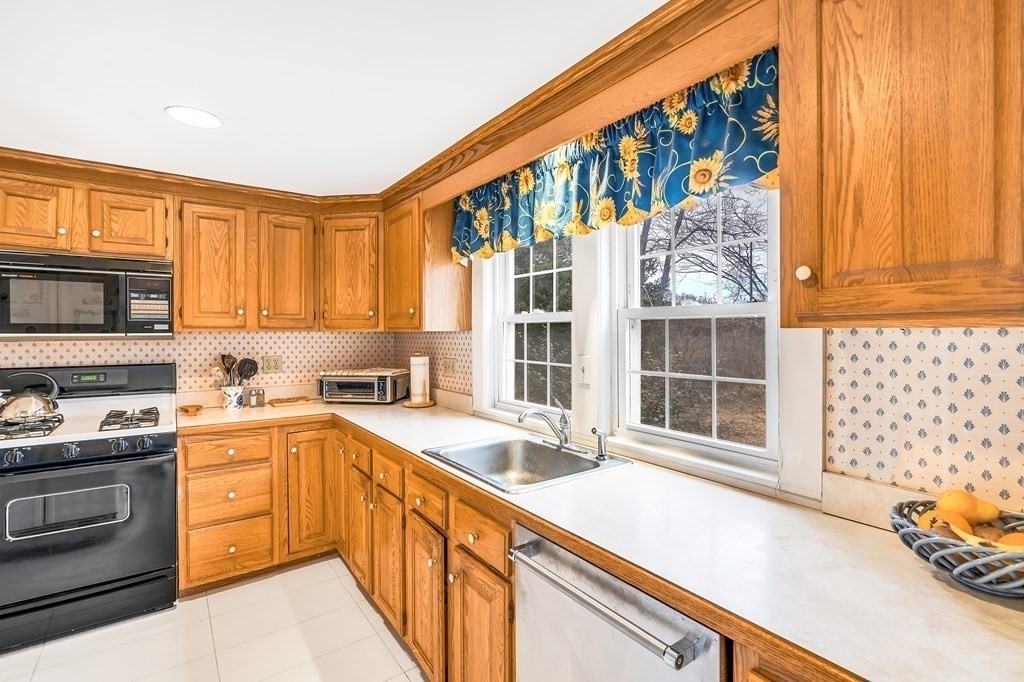 105 Hartford Street Natick, MA 01760 - Photo 18 of 41 a kitchen with a sink and large window