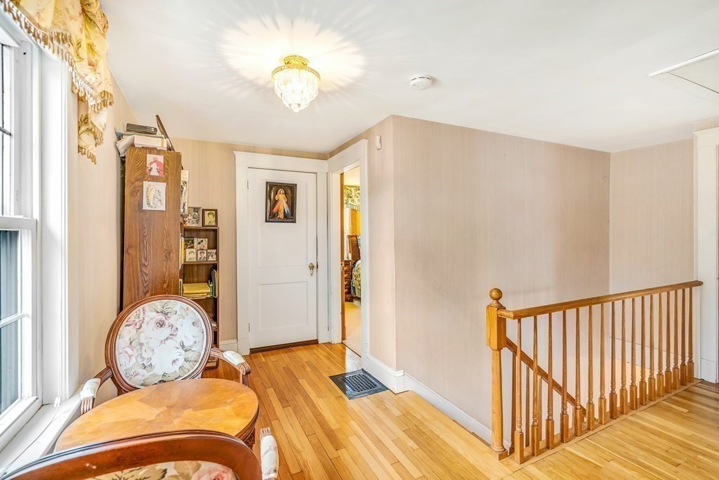 105 Hartford Street Natick, MA 01760 - Photo 22 of 41 a bedroom with bed and wooden floor
