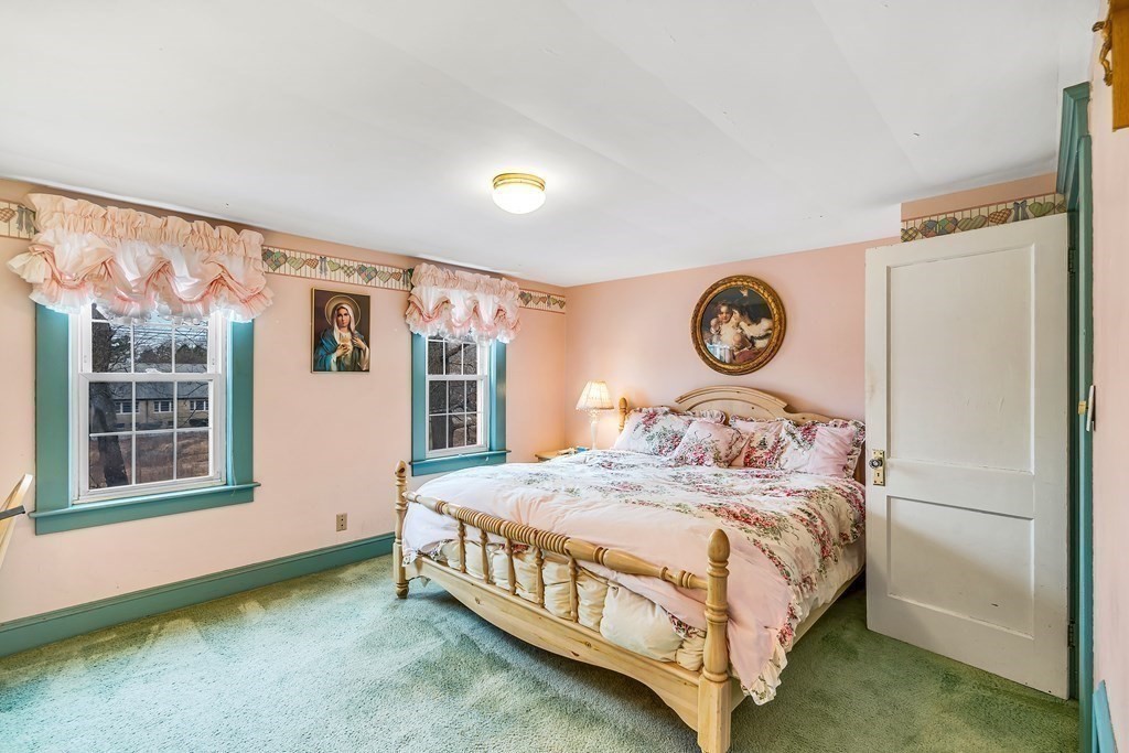 105 Hartford Street Natick, MA 01760 - Photo 23 of 41 a bedroom with a bed and a window