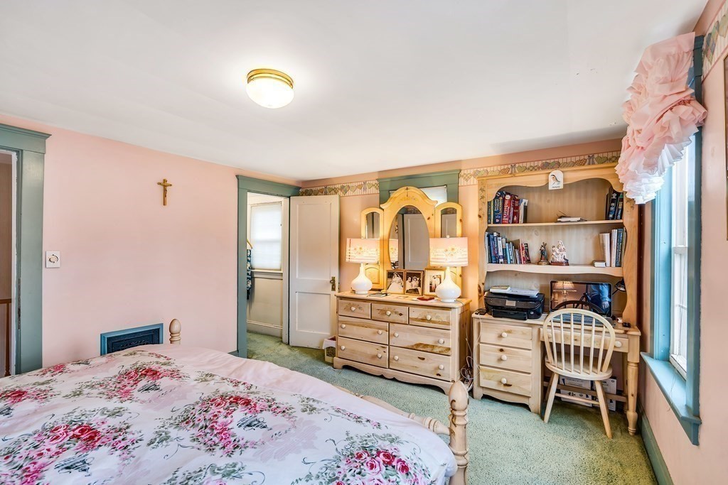 105 Hartford Street Natick, MA 01760 - Photo 24 of 41 a bedroom with a bed and a cabinets