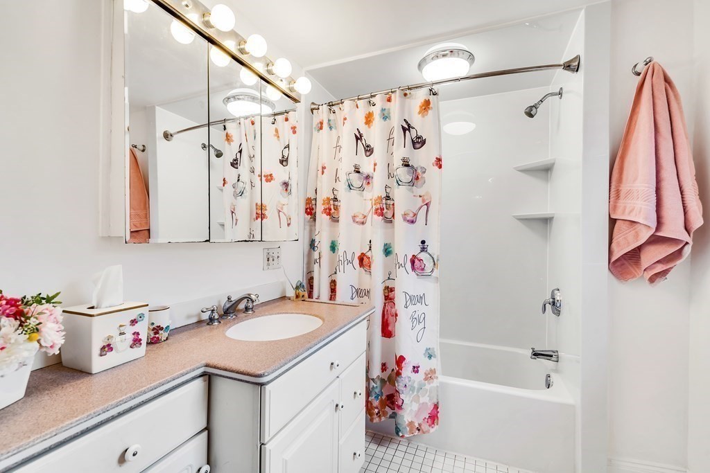 105 Hartford Street Natick, MA 01760 - Photo 25 of 41 a bathroom with a sink toilet and shower
