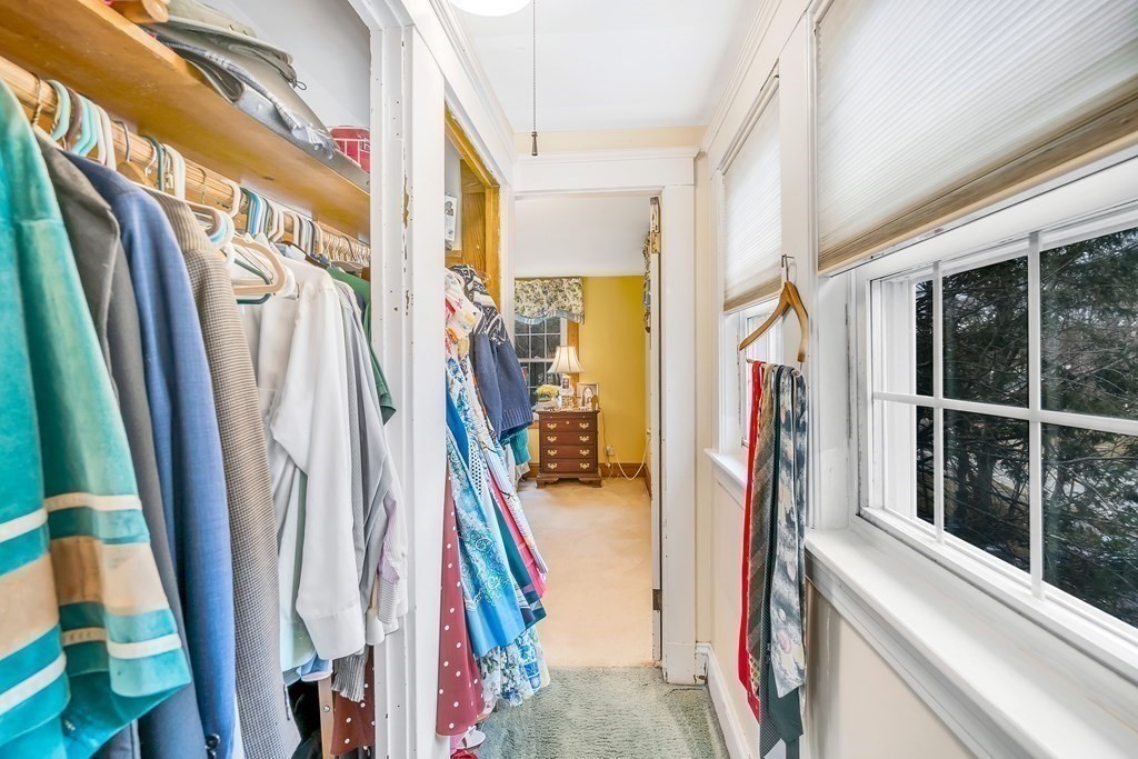 105 Hartford Street Natick, MA 01760 - Photo 28 of 41 a view of walk in closet with clothes and shoes