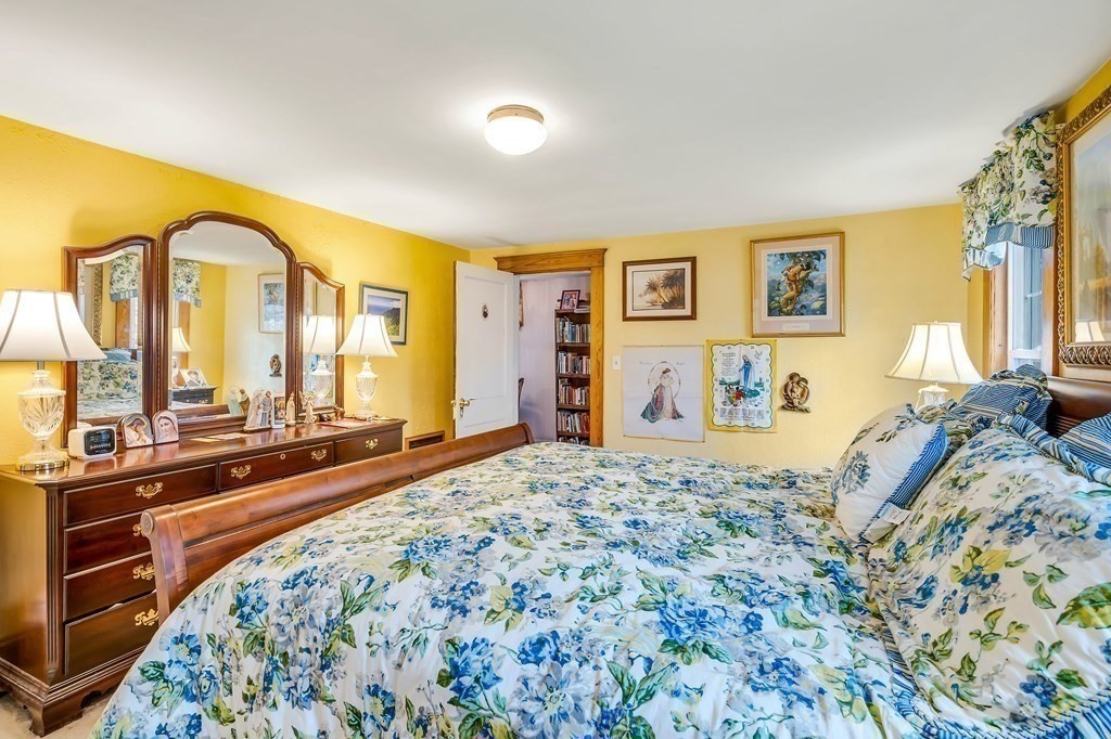 105 Hartford Street Natick, MA 01760 - Photo 29 of 41 a bedroom with a bed and a large mirror on the dresser