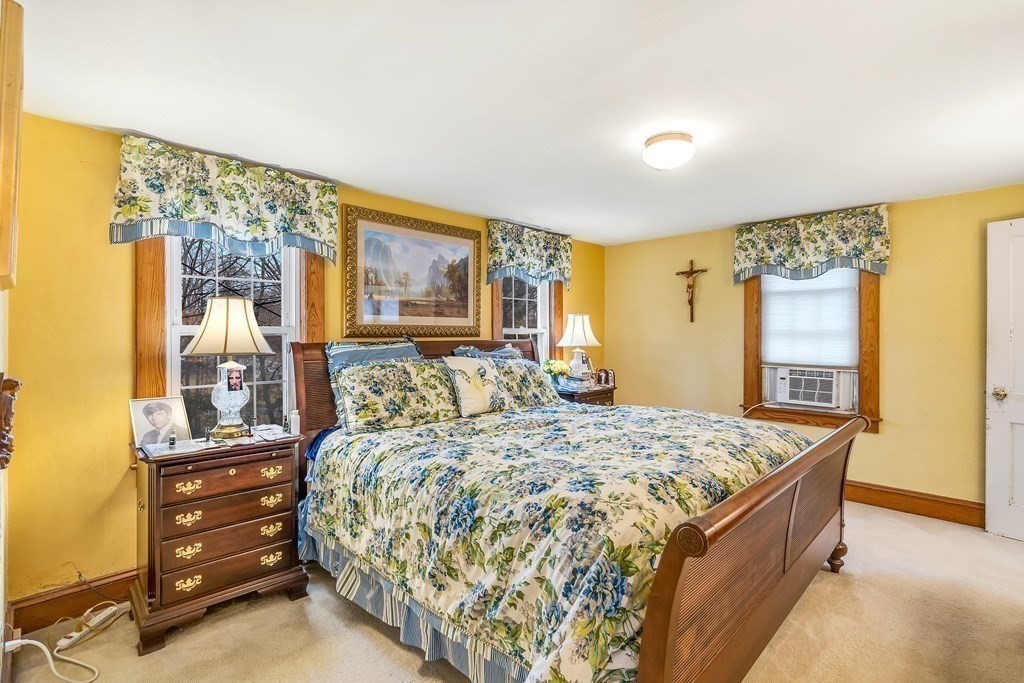 105 Hartford Street Natick, MA 01760 - Photo 30 of 41 a bed room with a bed and a dresser