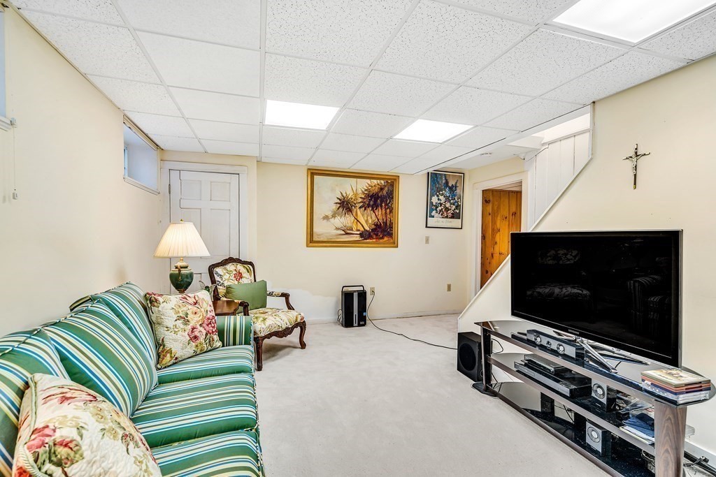 105 Hartford Street Natick, MA 01760 - Photo 31 of 41 a living room with furniture and a flat screen tv