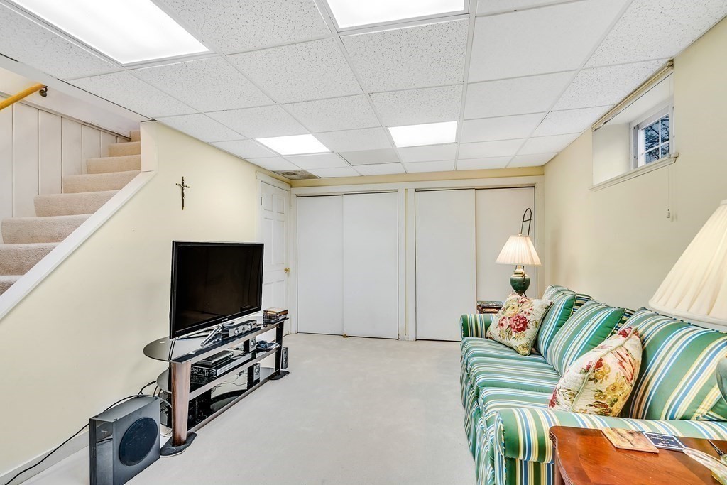 105 Hartford Street Natick, MA 01760 - Photo 32 of 41 a living room with furniture and a flat screen tv