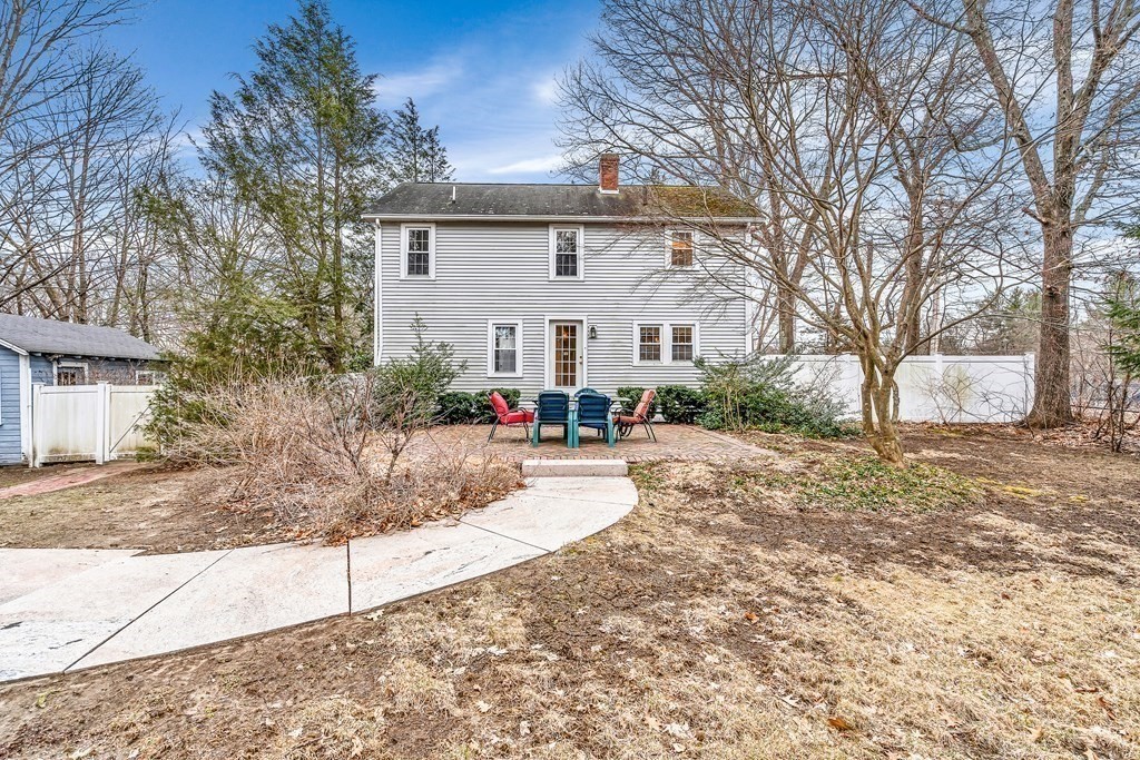 105 Hartford Street Natick, MA 01760 - Photo 40 of 41 a front view of a house with a yard and garage