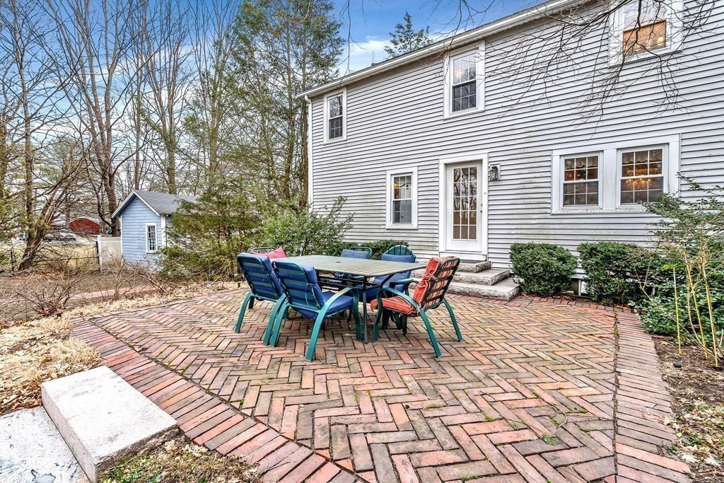 105 Hartford Street Natick, MA 01760 - Photo 41 of 41 a view of a house with backyard and sitting area