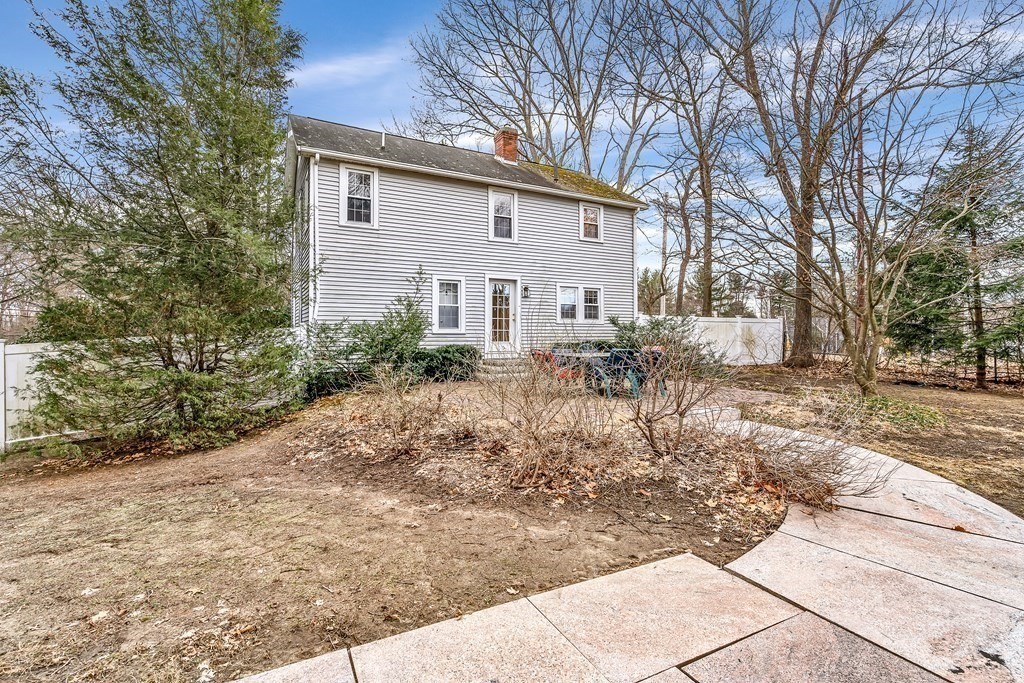 105 Hartford Street Natick, MA 01760 - Photo 5 of 41 a front view of a house with garden