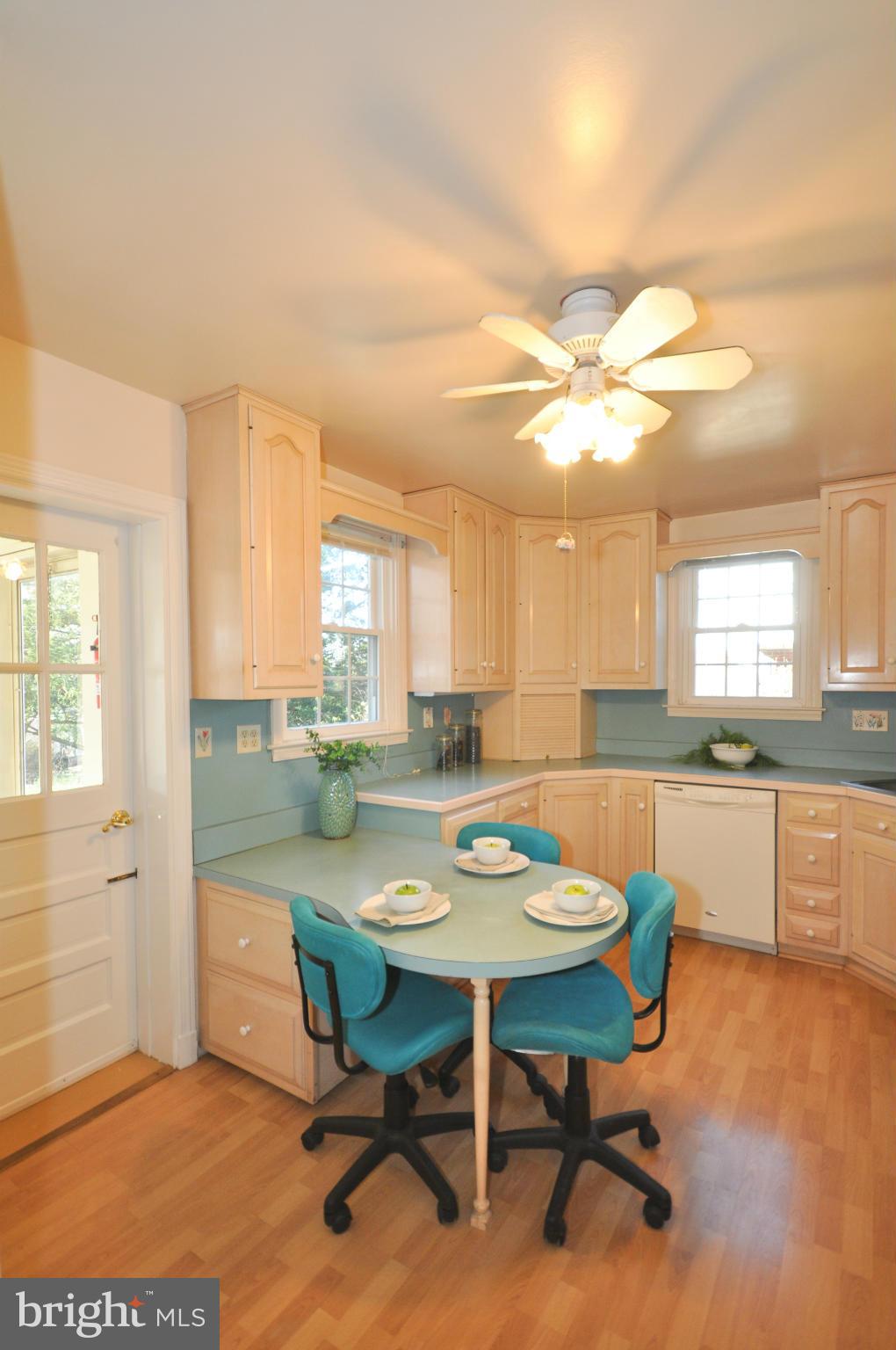 409 Aigburth Road Baltimore, MD 21286 - Photo 11 of 27 a view of a dining room with furniture and a kitchen