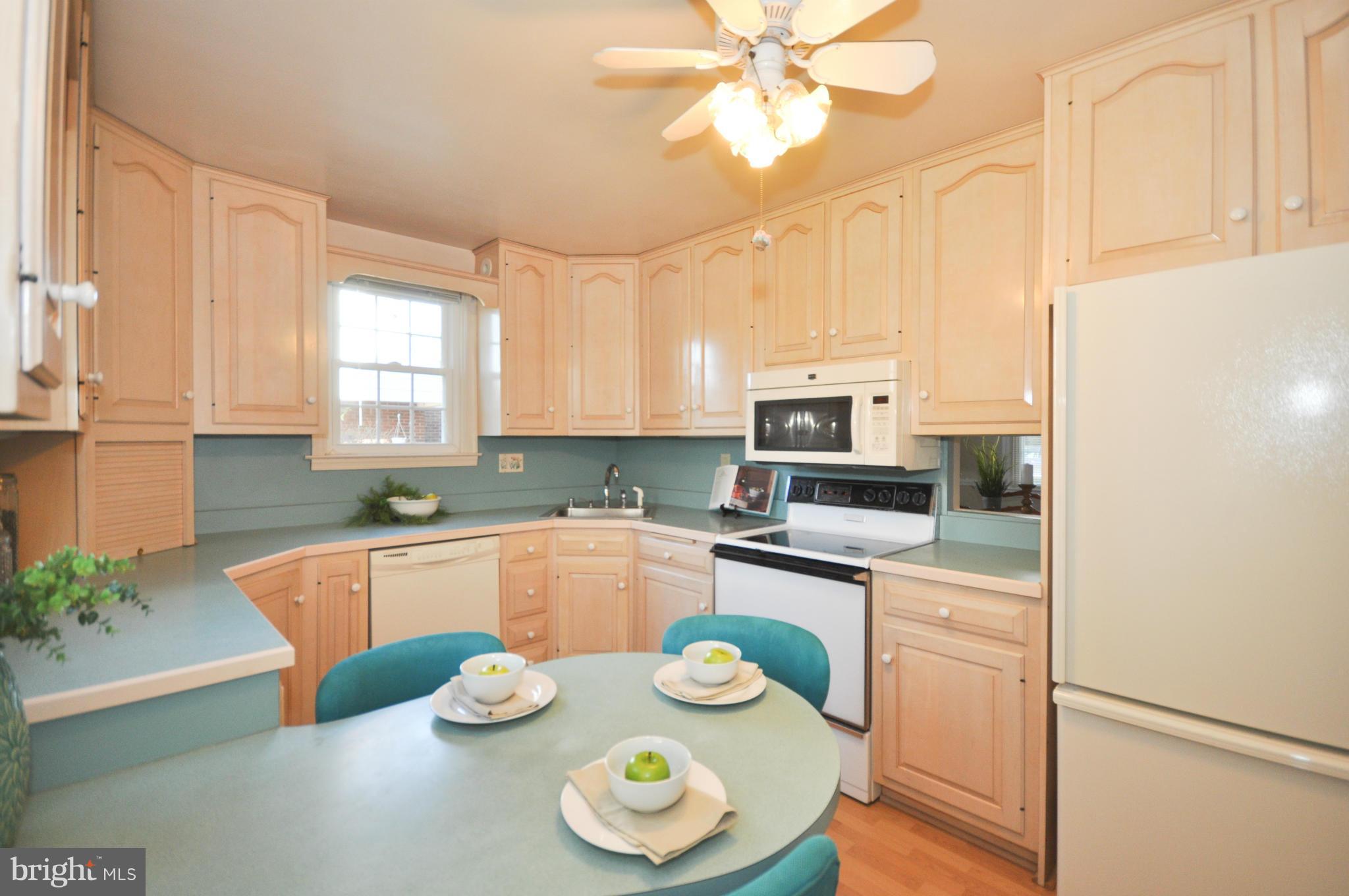 409 Aigburth Road Baltimore, MD 21286 - Photo 12 of 27 a kitchen with stainless steel appliances granite countertop a sink and a refrigerator