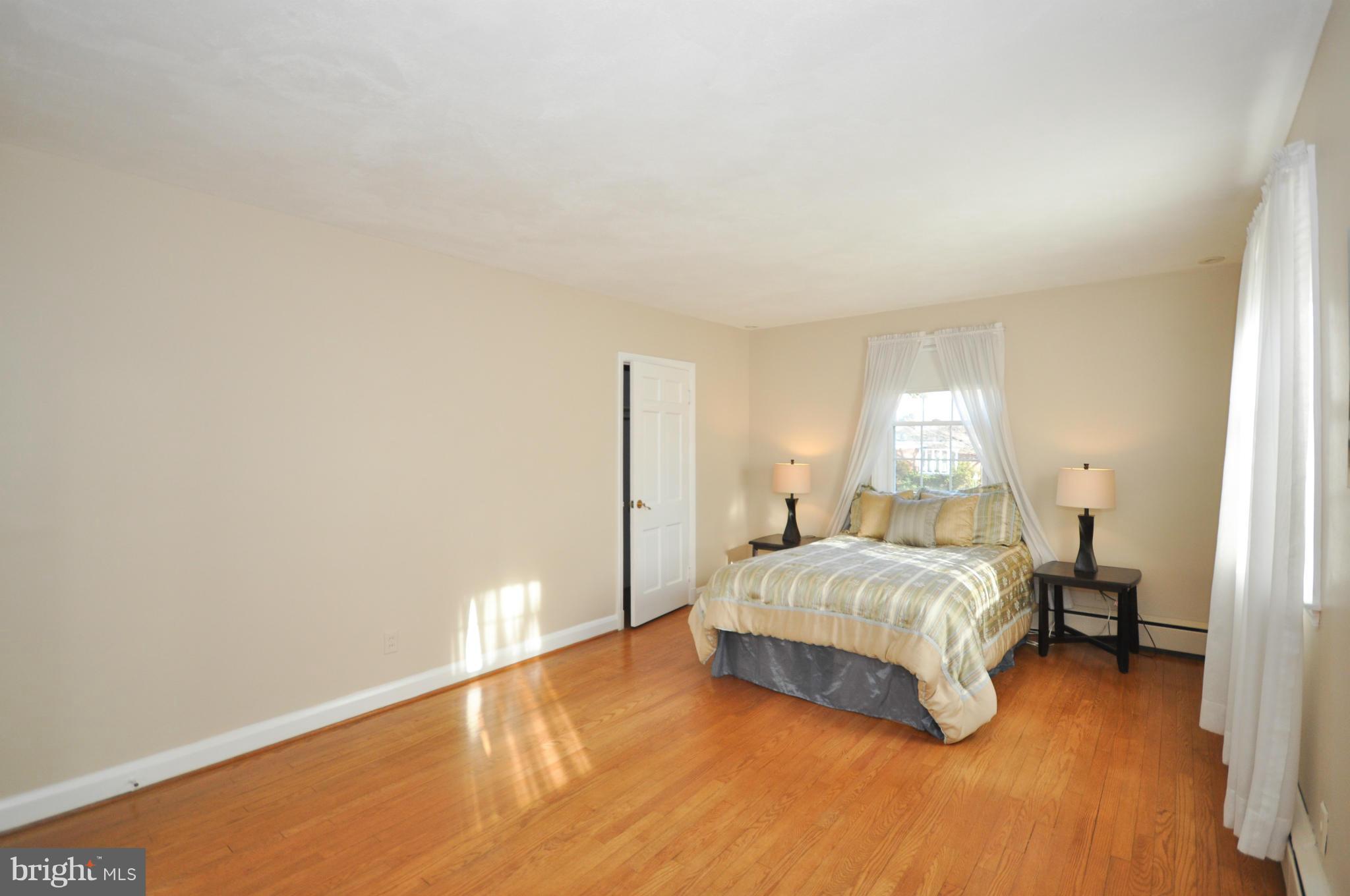 409 Aigburth Road Baltimore, MD 21286 - Photo 17 of 27 a bedroom with a bed and a night stand
