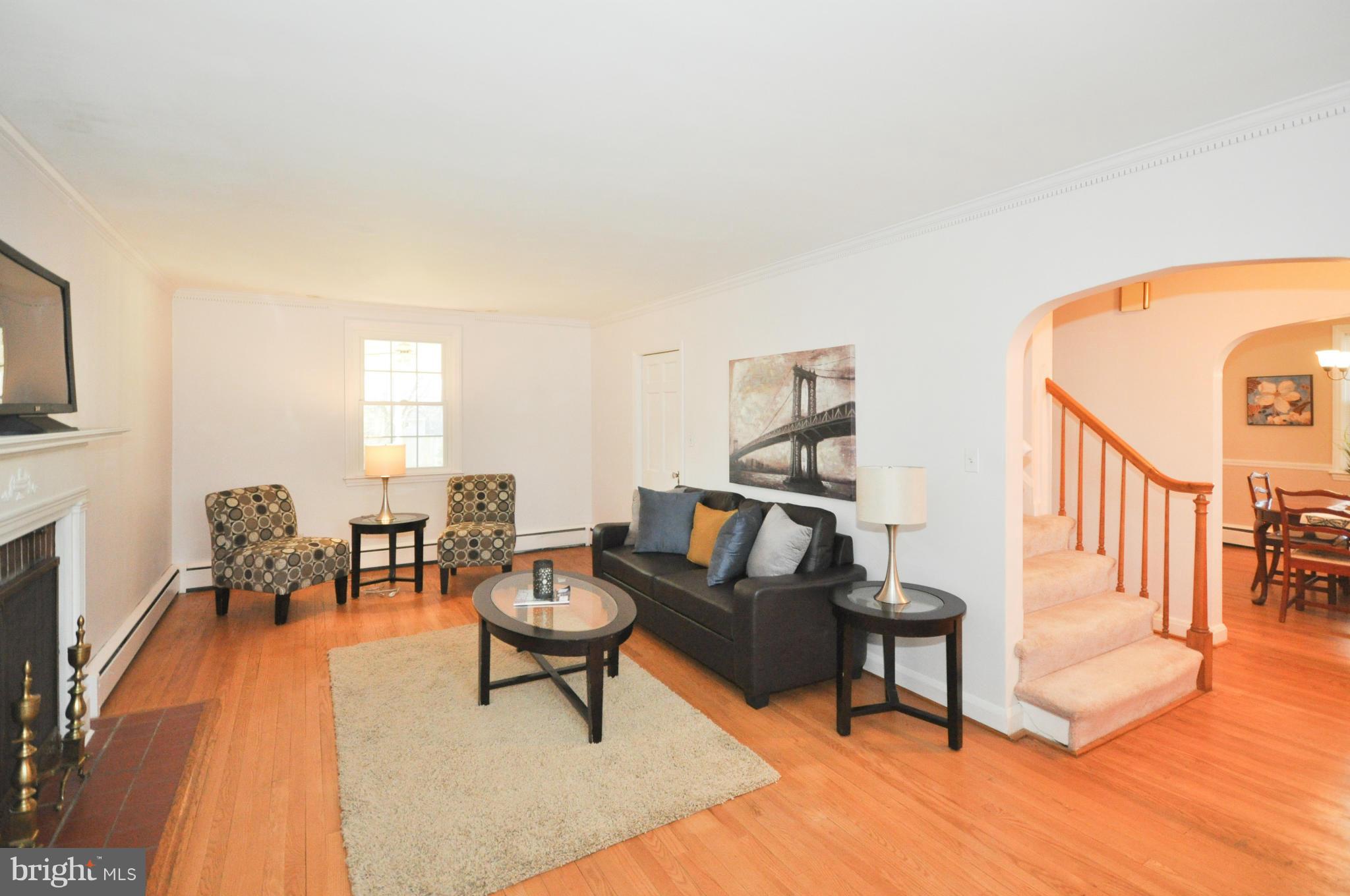 409 Aigburth Road Baltimore, MD 21286 - Photo 5 of 27 a living room with furniture and a fireplace