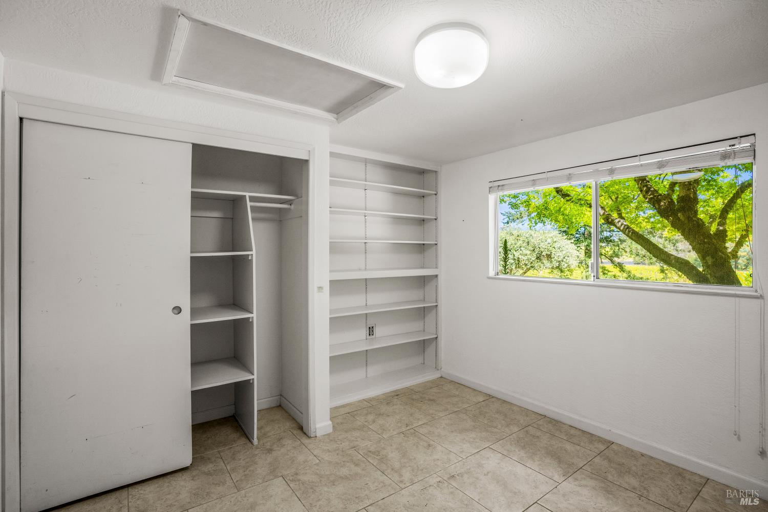 625-629 Hill Road Angwin, CA 94508 - Photo 23 of 64 a view of an empty room with a window and a kitchen