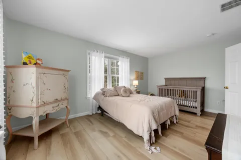 a bed room with a bed and a window