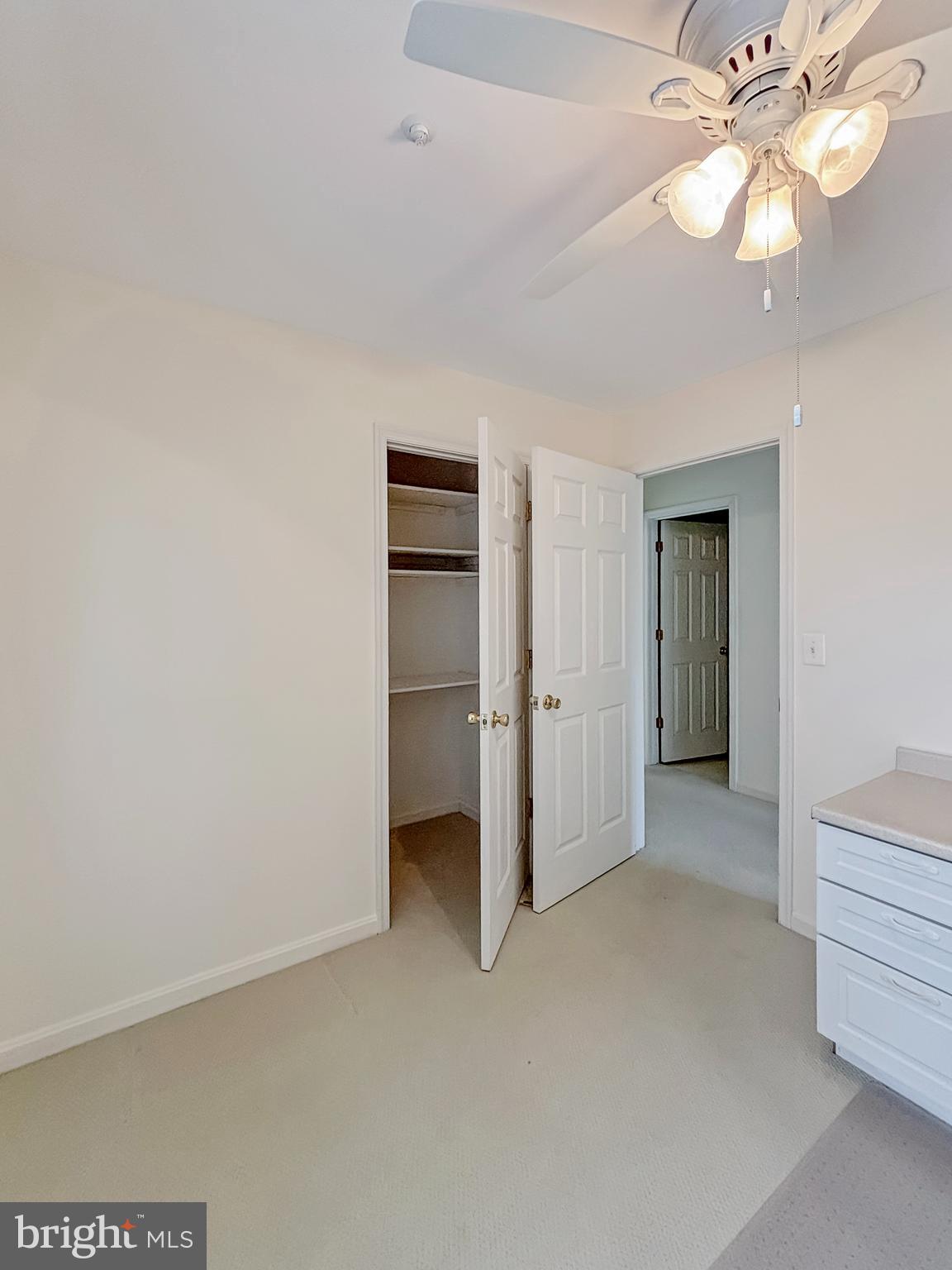 2023 Rudy Serra Drive, Unit 2D Eldersburg, MD 21784 - Photo 12 of 25 a view of empty room with window and ceiling fan