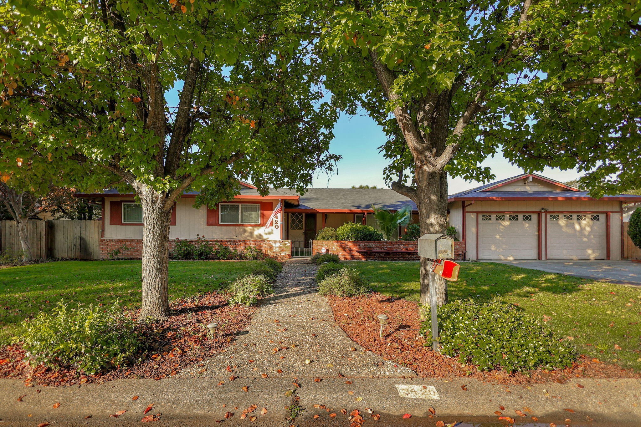 a front view of a house with garden