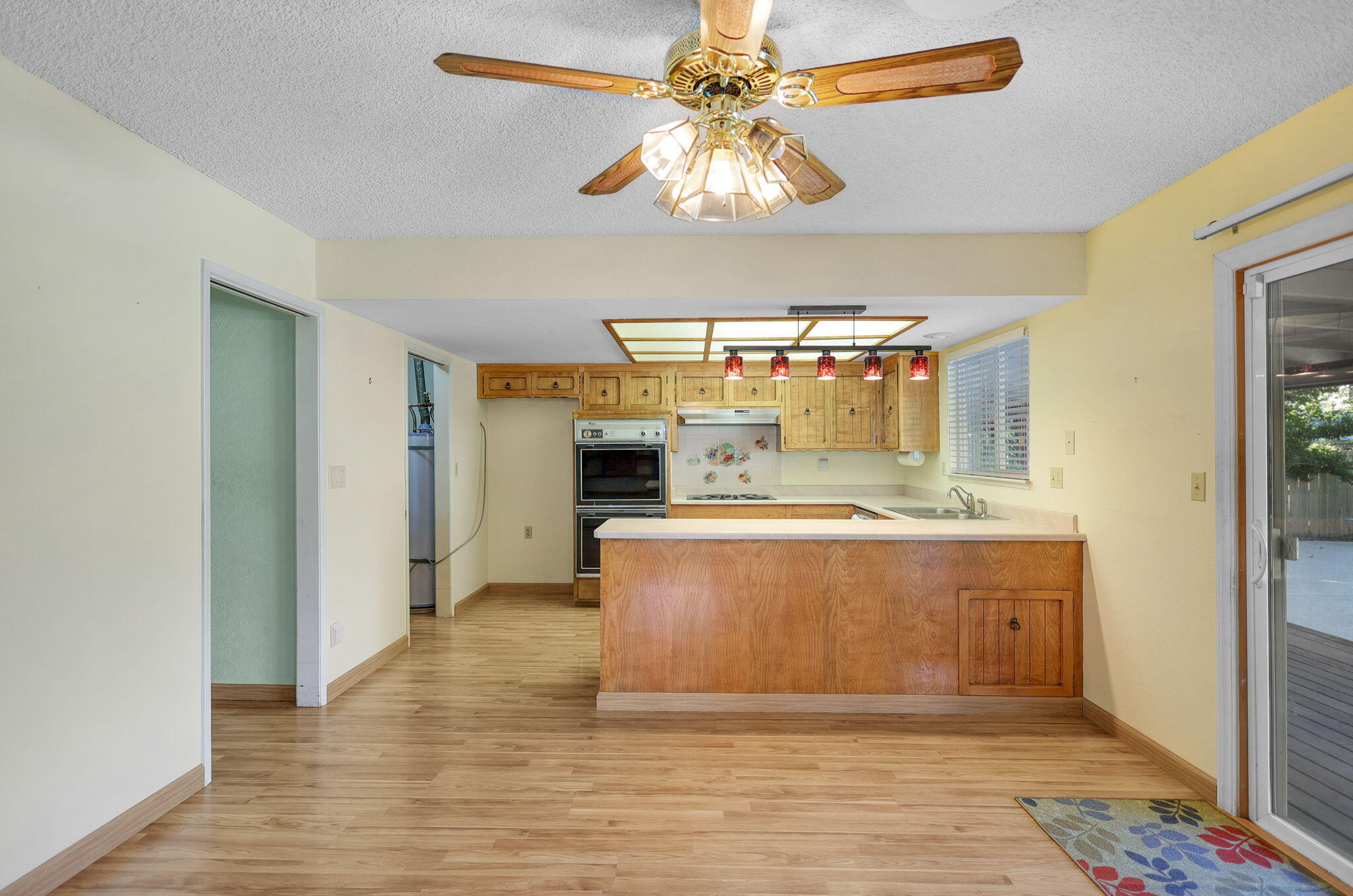 3420 Riverview Drive Redding, CA 96001 - Photo 11 of 40 a view of kitchen with stainless steel appliances granite countertop cabinets and wooden floor
