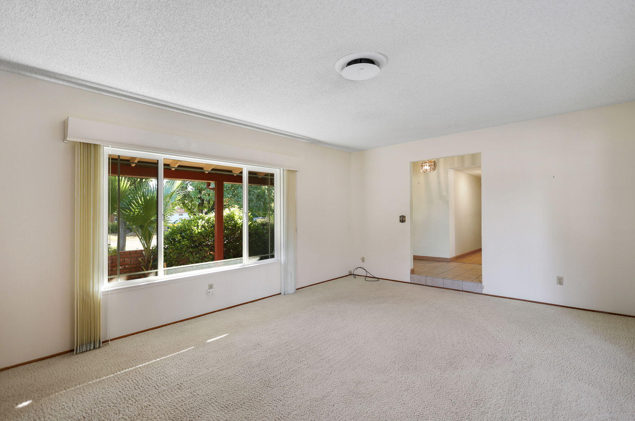 3420 Riverview Drive Redding, CA 96001 - Photo 14 of 40 a view of an empty room with a window