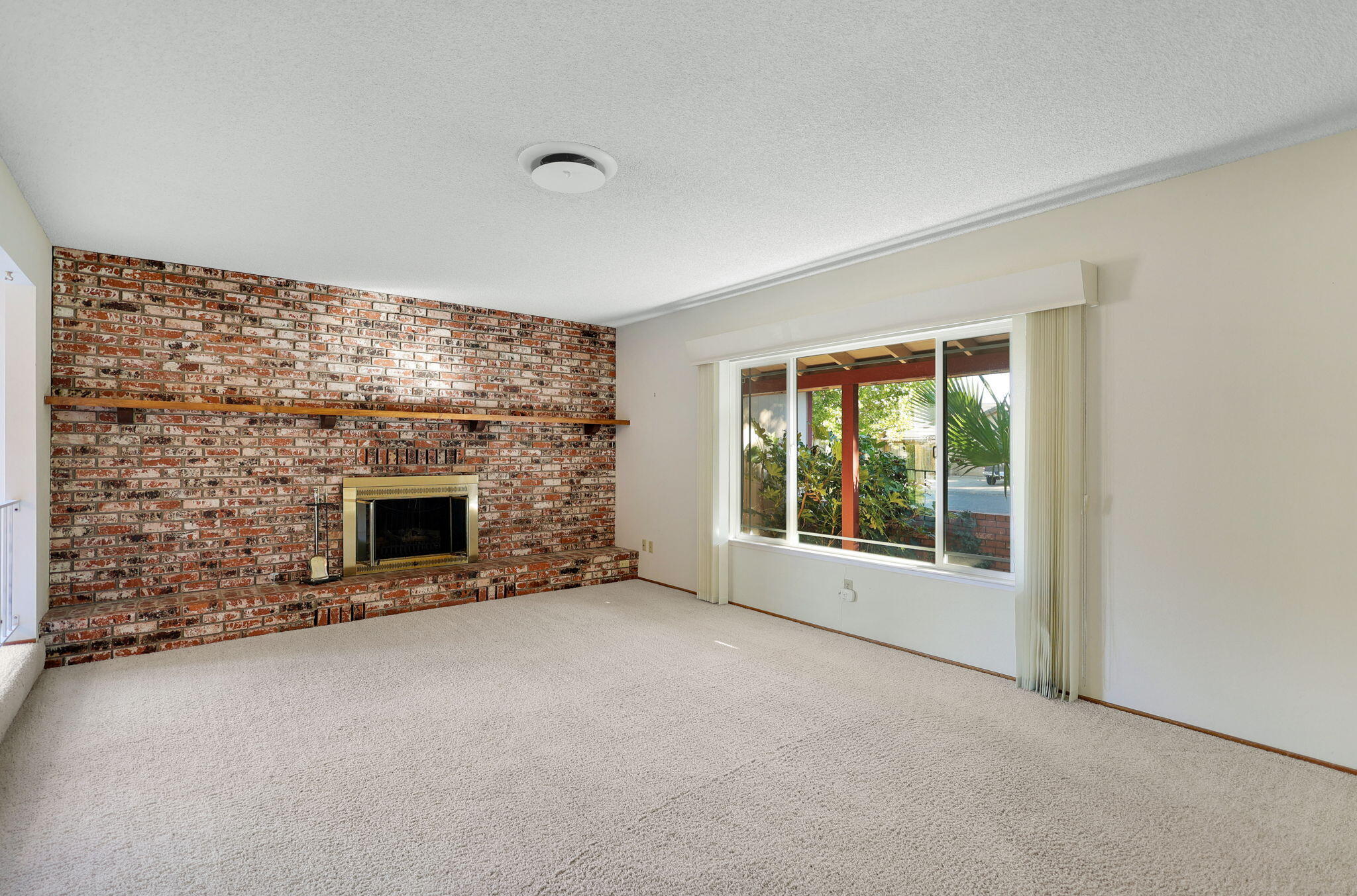 3420 Riverview Drive Redding, CA 96001 - Photo 16 of 40 a view of empty room with a fireplace