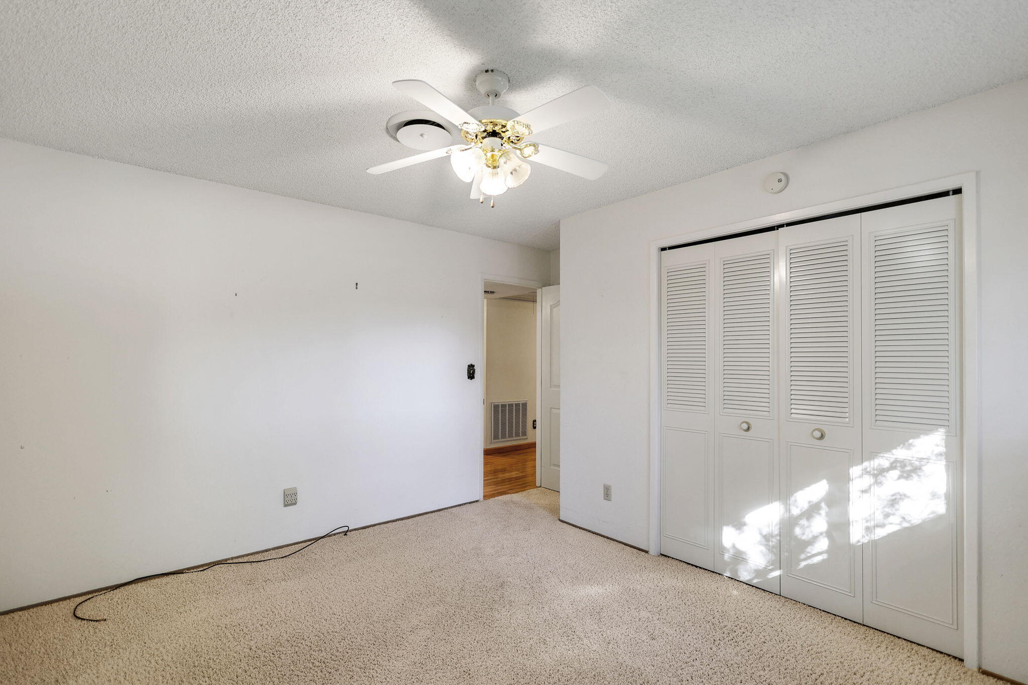 3420 Riverview Drive Redding, CA 96001 - Photo 19 of 40 an empty room with windows and fan