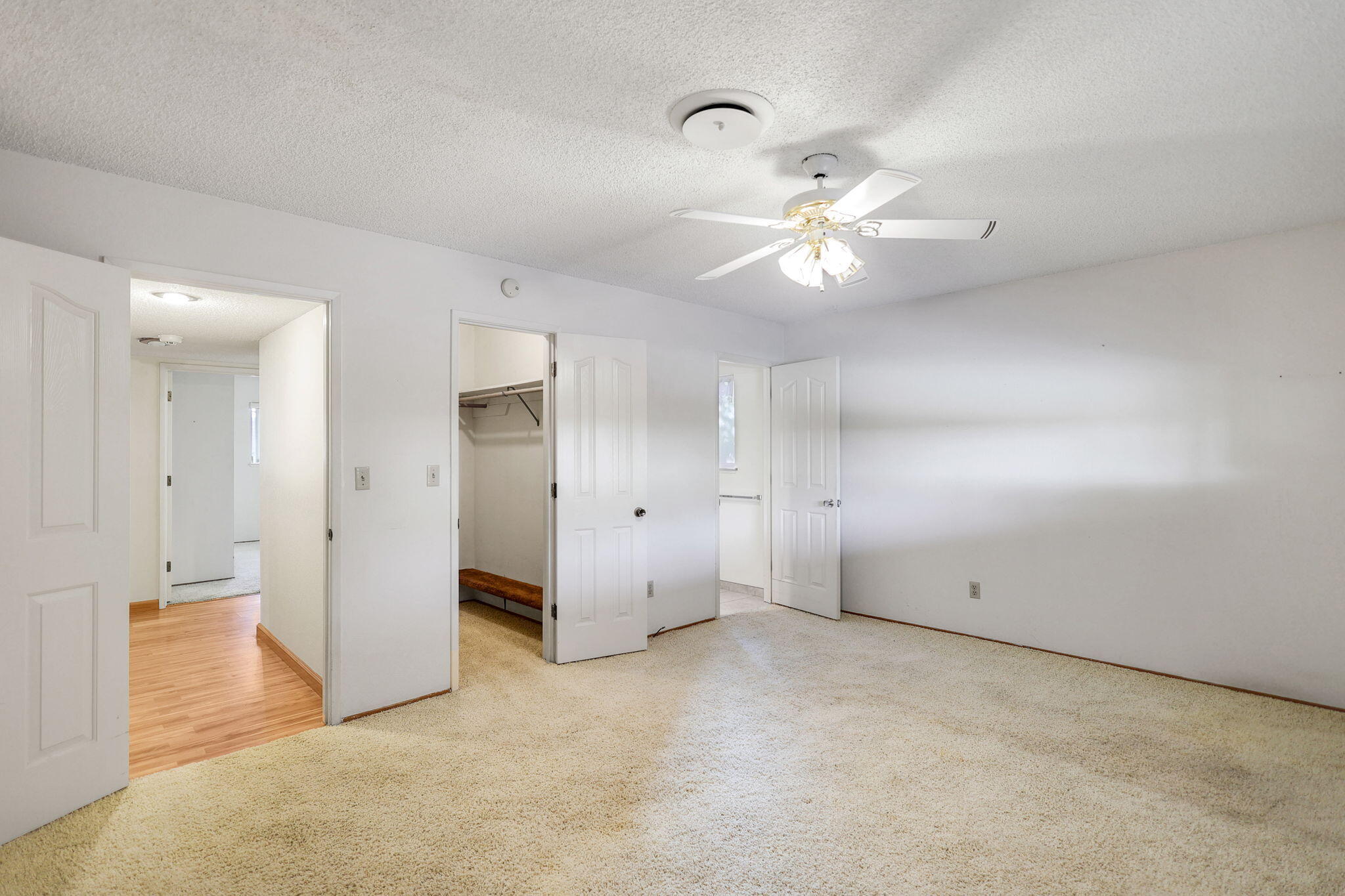 3420 Riverview Drive Redding, CA 96001 - Photo 22 of 40 an empty room with closet and a ceiling fan