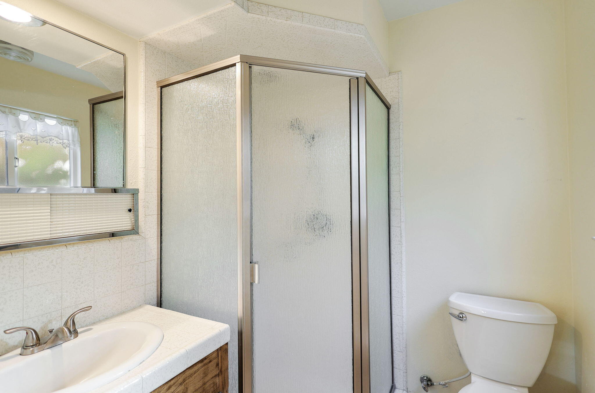 3420 Riverview Drive Redding, CA 96001 - Photo 24 of 40 a bathroom with a granite countertop sink toilet and shower