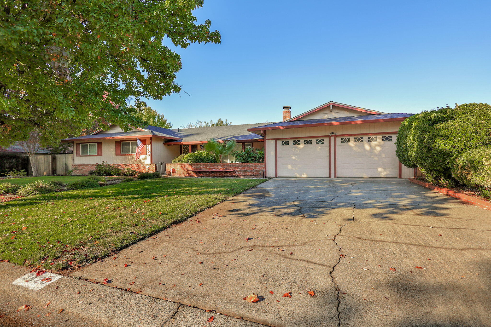 3420 Riverview Drive Redding, CA 96001 - Photo 3 of 40 a front view of a house with a yard