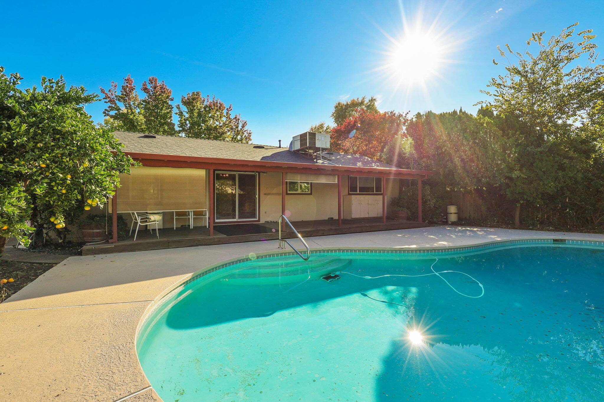 3420 Riverview Drive Redding, CA 96001 - Photo 31 of 40 a view of a house with a swimming pool and a yard