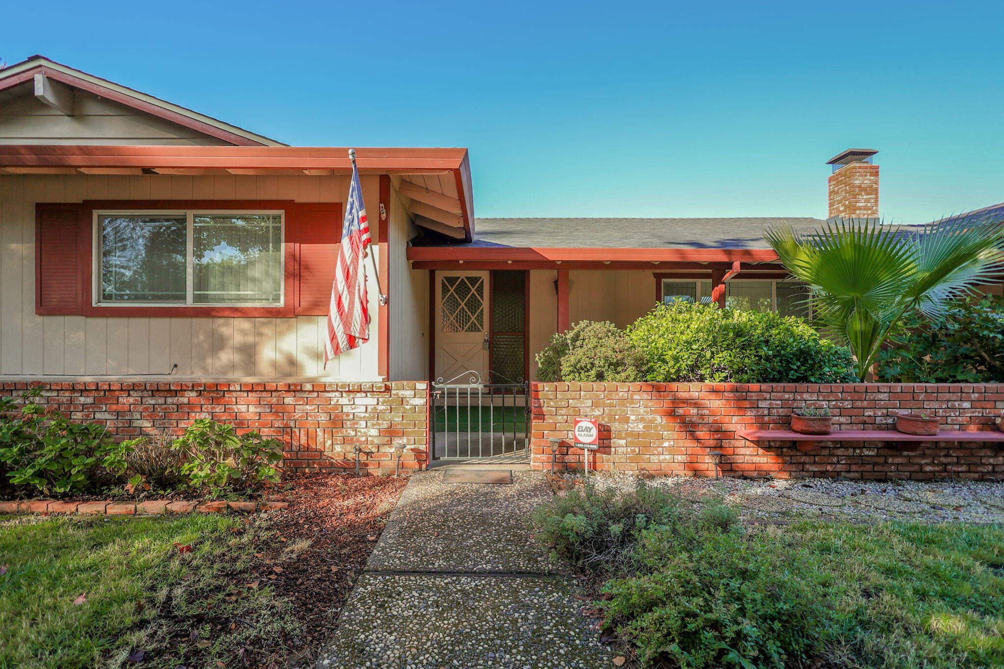 3420 Riverview Drive Redding, CA 96001 - Photo 4 of 40 a front view of a house with a yard