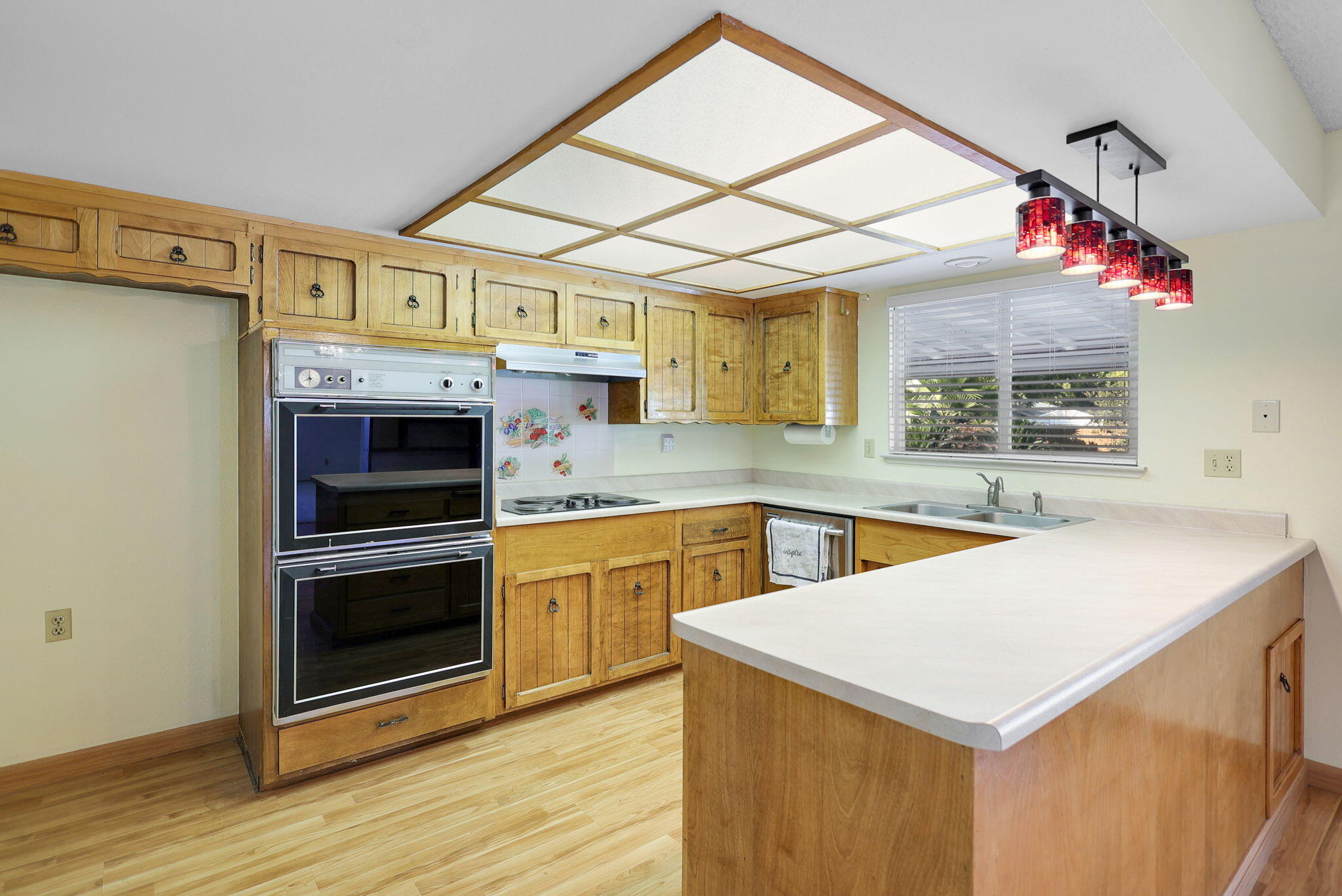 3420 Riverview Drive Redding, CA 96001 - Photo 5 of 40 a kitchen with a stove a sink and a refrigerator