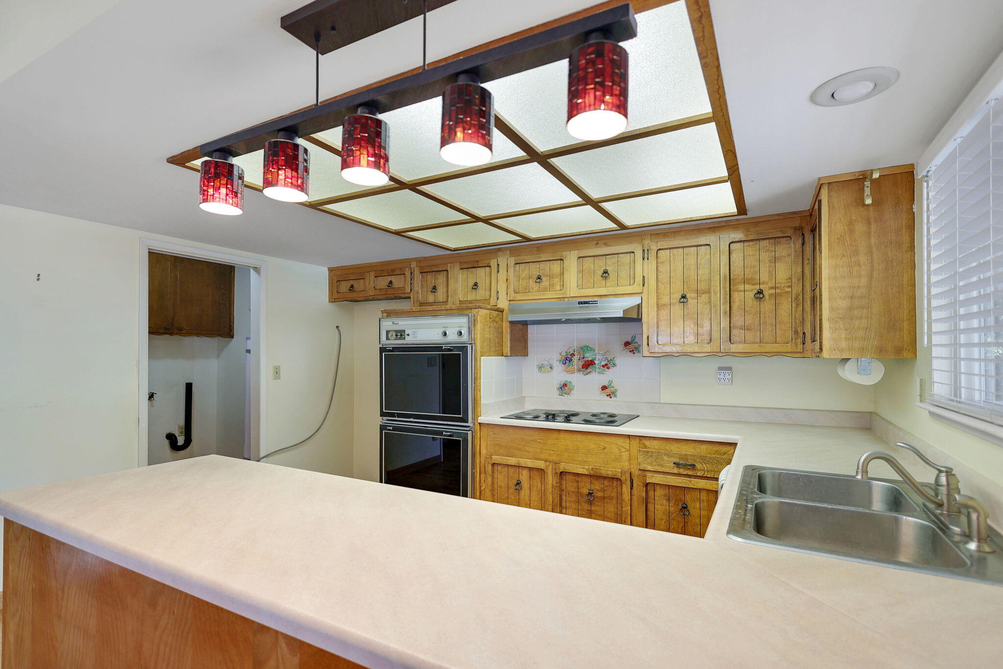 3420 Riverview Drive Redding, CA 96001 - Photo 6 of 40 a kitchen that has a lot of cabinets in it