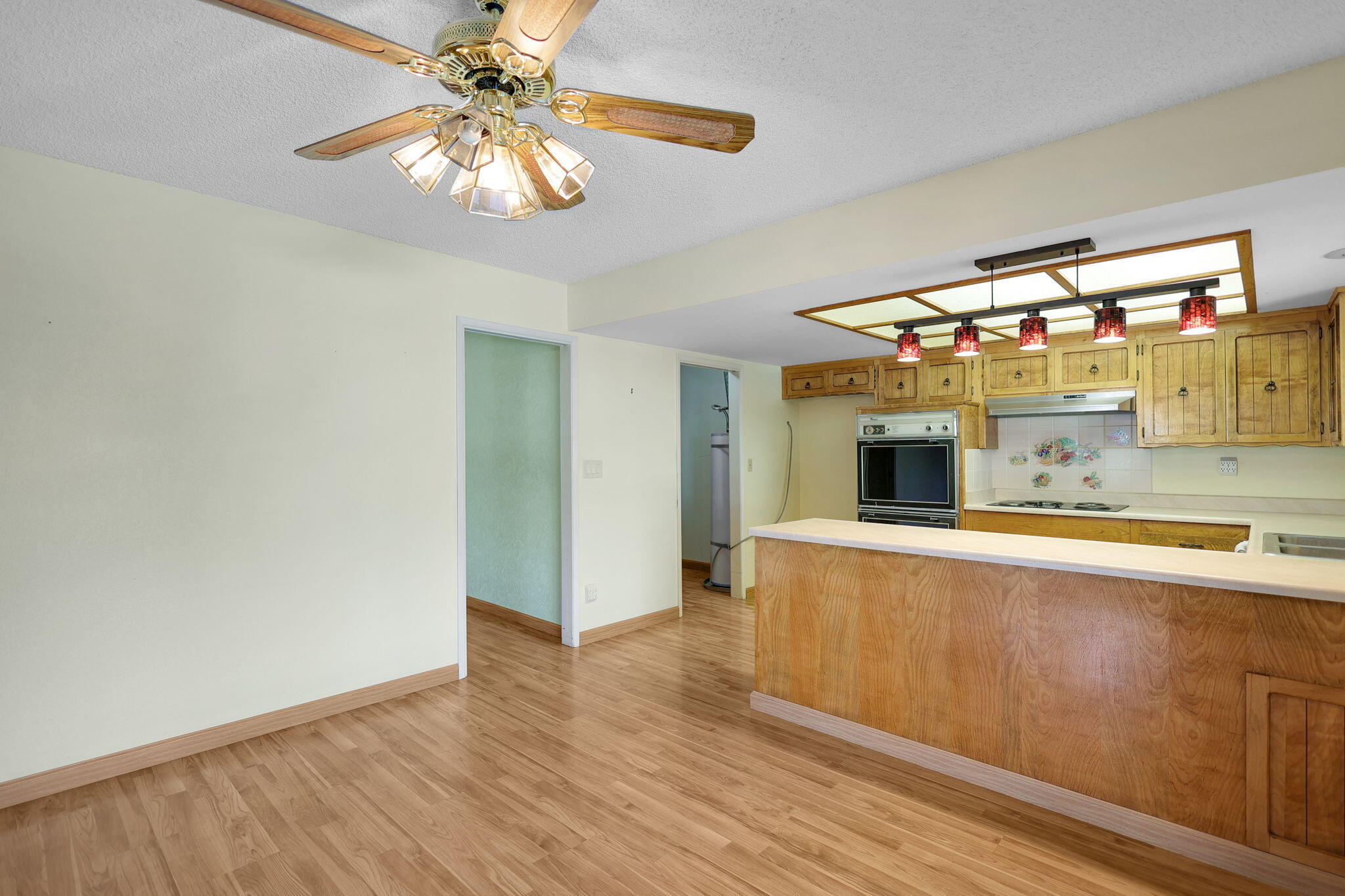 3420 Riverview Drive Redding, CA 96001 - Photo 10 of 40 a view of a kitchen with a sink and wooden floor