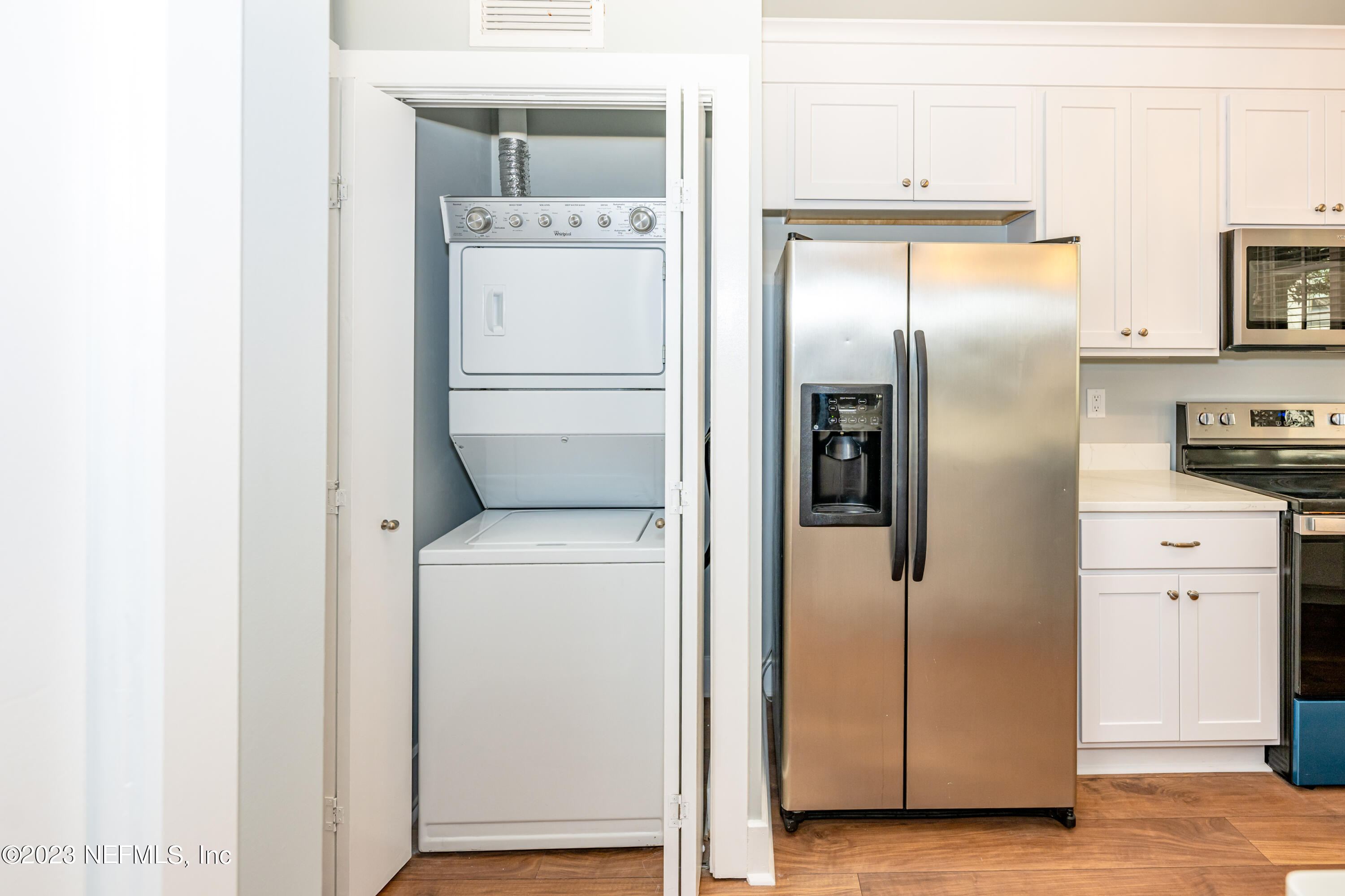 1661 Riverside Avenue, Unit 119 Jacksonville, FL 32204 - Photo 17 of 45 a kitchen with metallic refrigerator freezer and a dishwasher