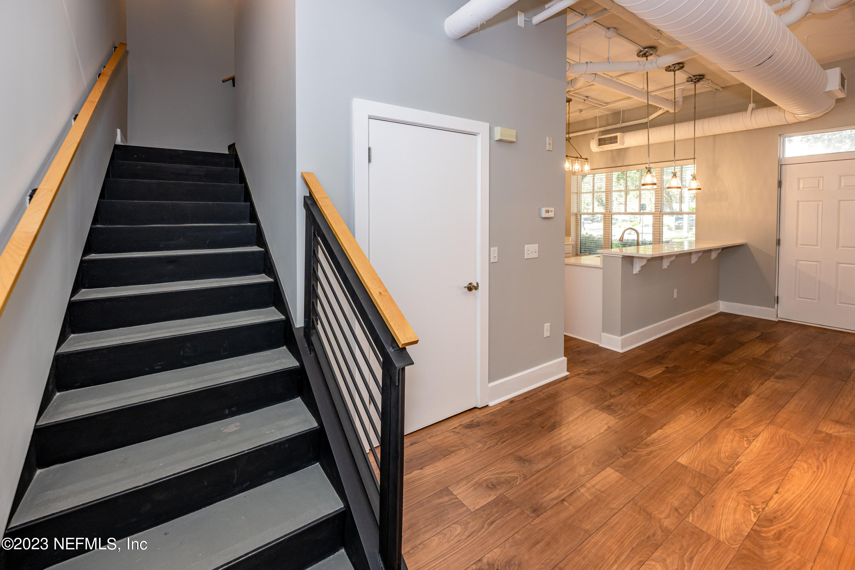 1661 Riverside Avenue, Unit 119 Jacksonville, FL 32204 - Photo 19 of 45 wooden floor in an empty room with a window