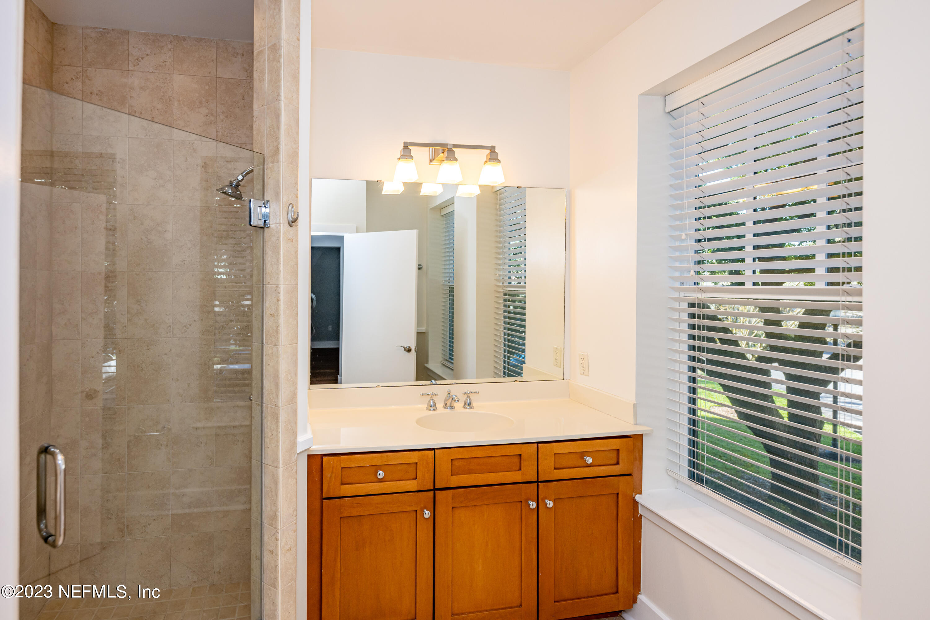1661 Riverside Avenue, Unit 119 Jacksonville, FL 32204 - Photo 27 of 45 a bathroom with a sink and a mirror