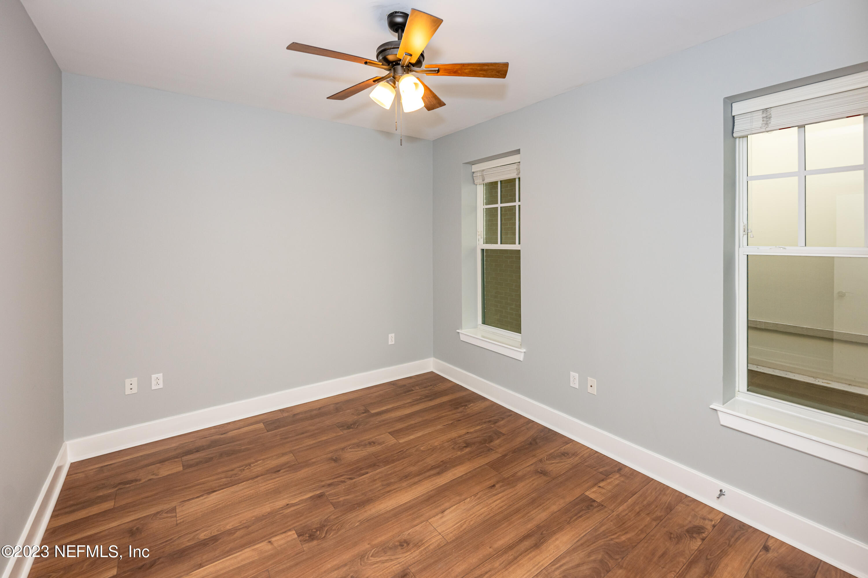 1661 Riverside Avenue, Unit 119 Jacksonville, FL 32204 - Photo 28 of 45 wooden floor in an empty room with a window