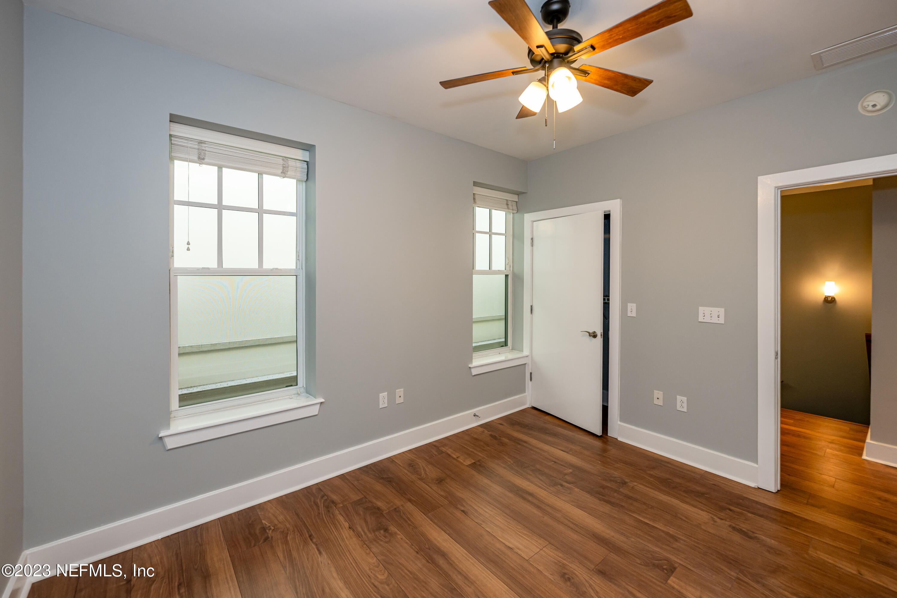 1661 Riverside Avenue, Unit 119 Jacksonville, FL 32204 - Photo 29 of 45 a view of an empty room with window and wooden floor