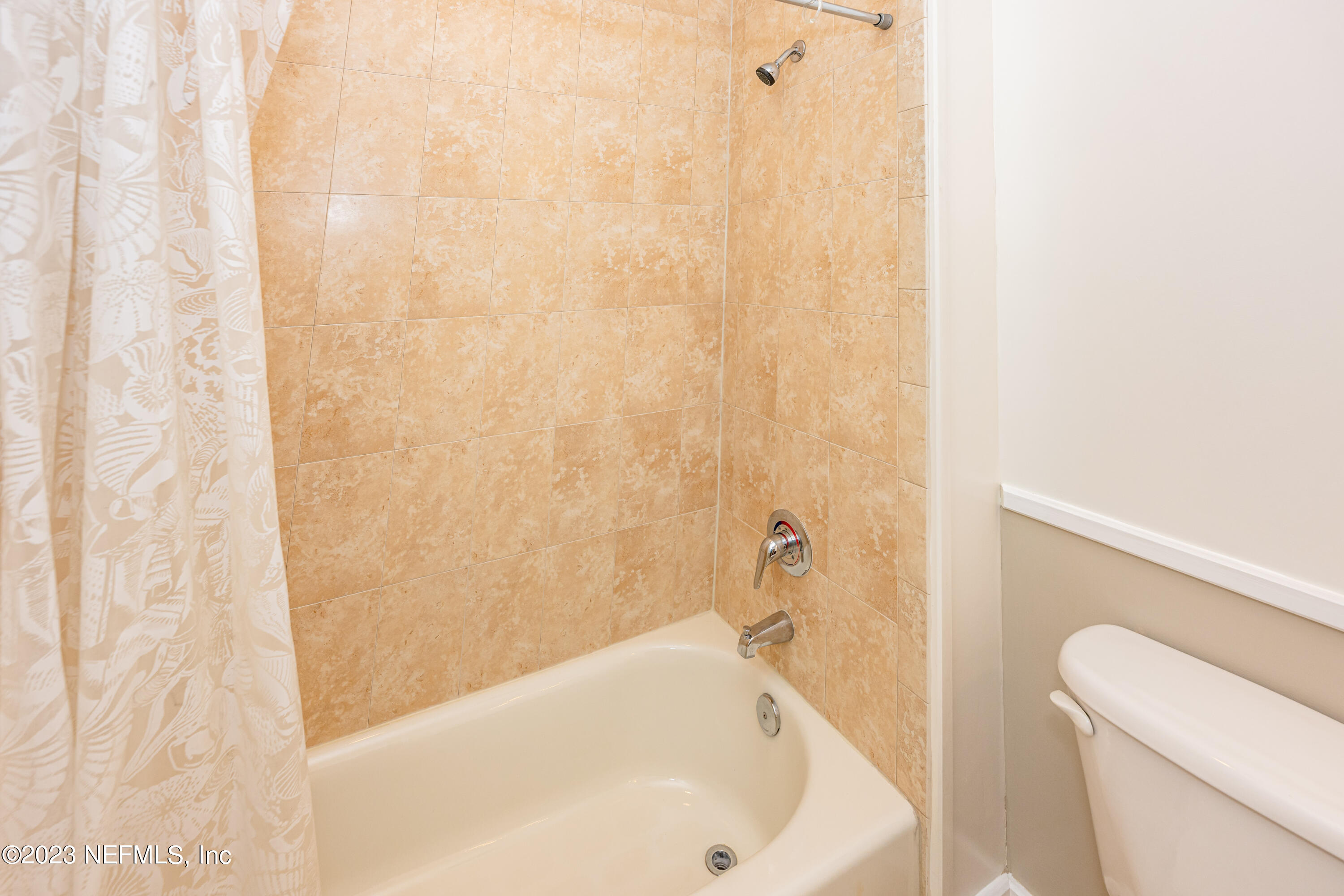 1661 Riverside Avenue, Unit 119 Jacksonville, FL 32204 - Photo 31 of 45 a bathroom with a bathtub and a toilet