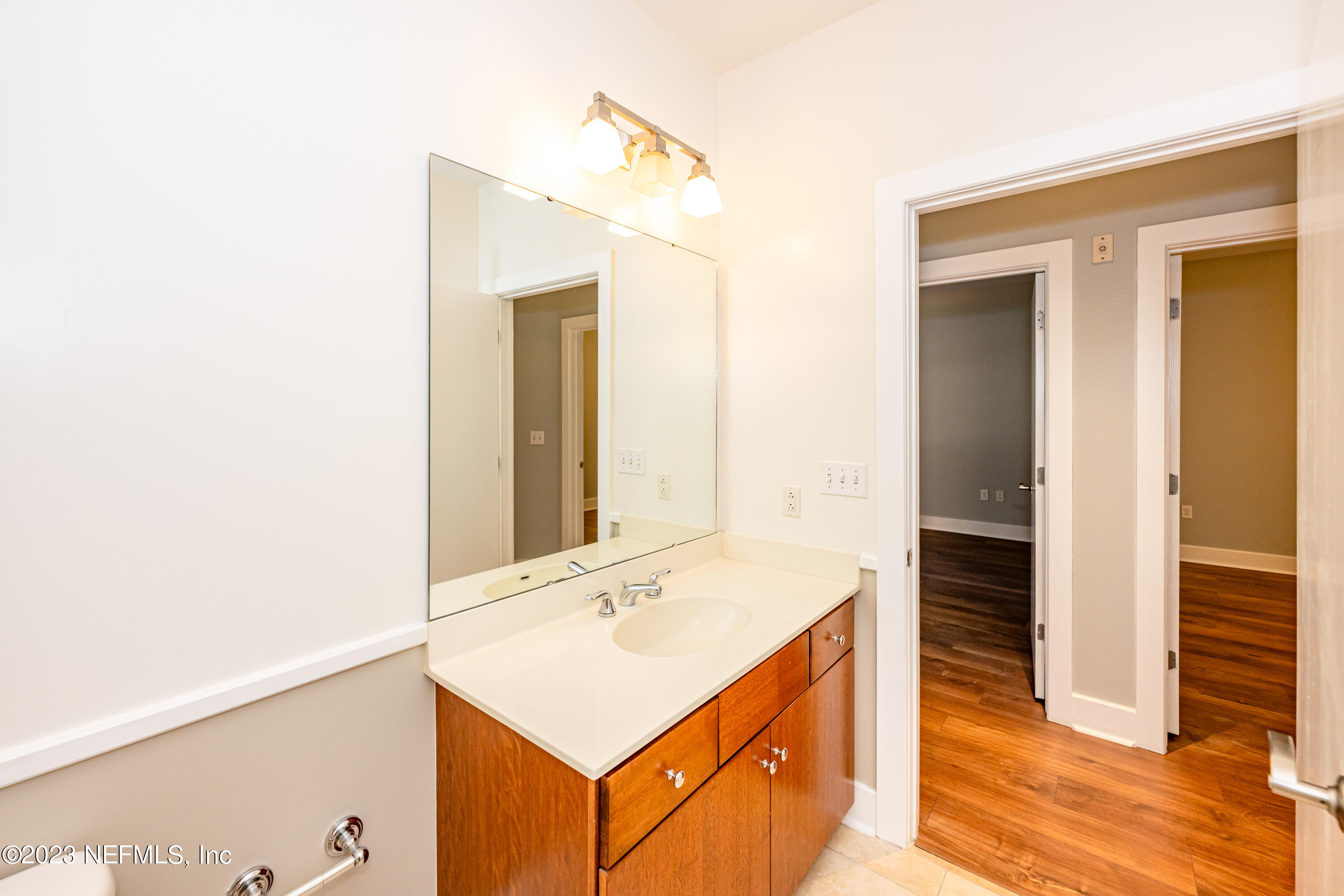 1661 Riverside Avenue, Unit 119 Jacksonville, FL 32204 - Photo 32 of 45 a bathroom with a sink a mirror and a shower