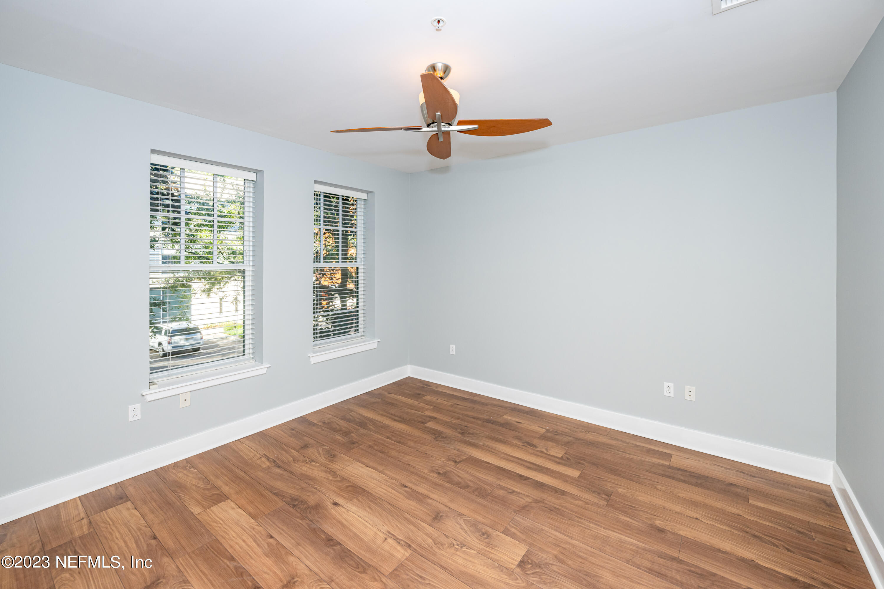 1661 Riverside Avenue, Unit 119 Jacksonville, FL 32204 - Photo 35 of 45 wooden floor in an empty room with a window