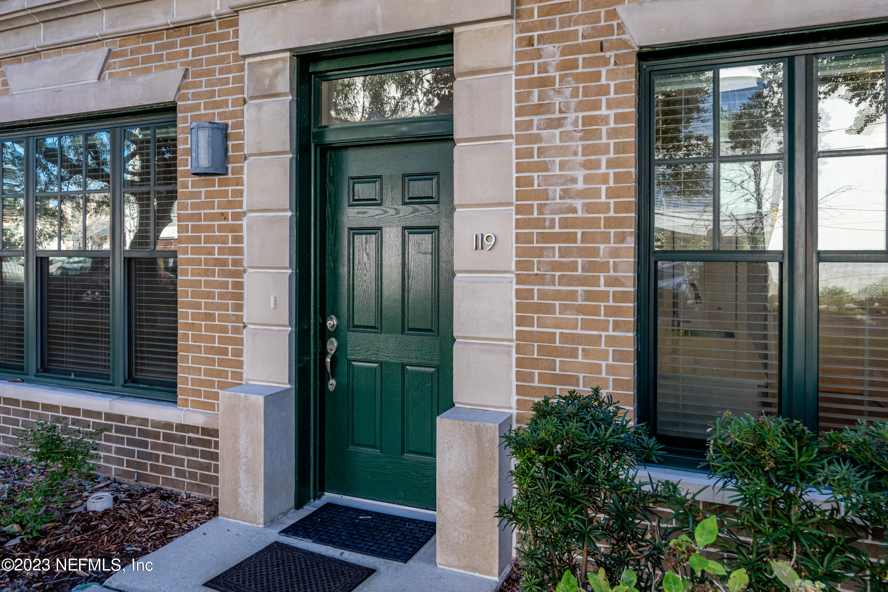 1661 Riverside Avenue, Unit 119 Jacksonville, FL 32204 - Photo 4 of 45 a view of front door of house and tree