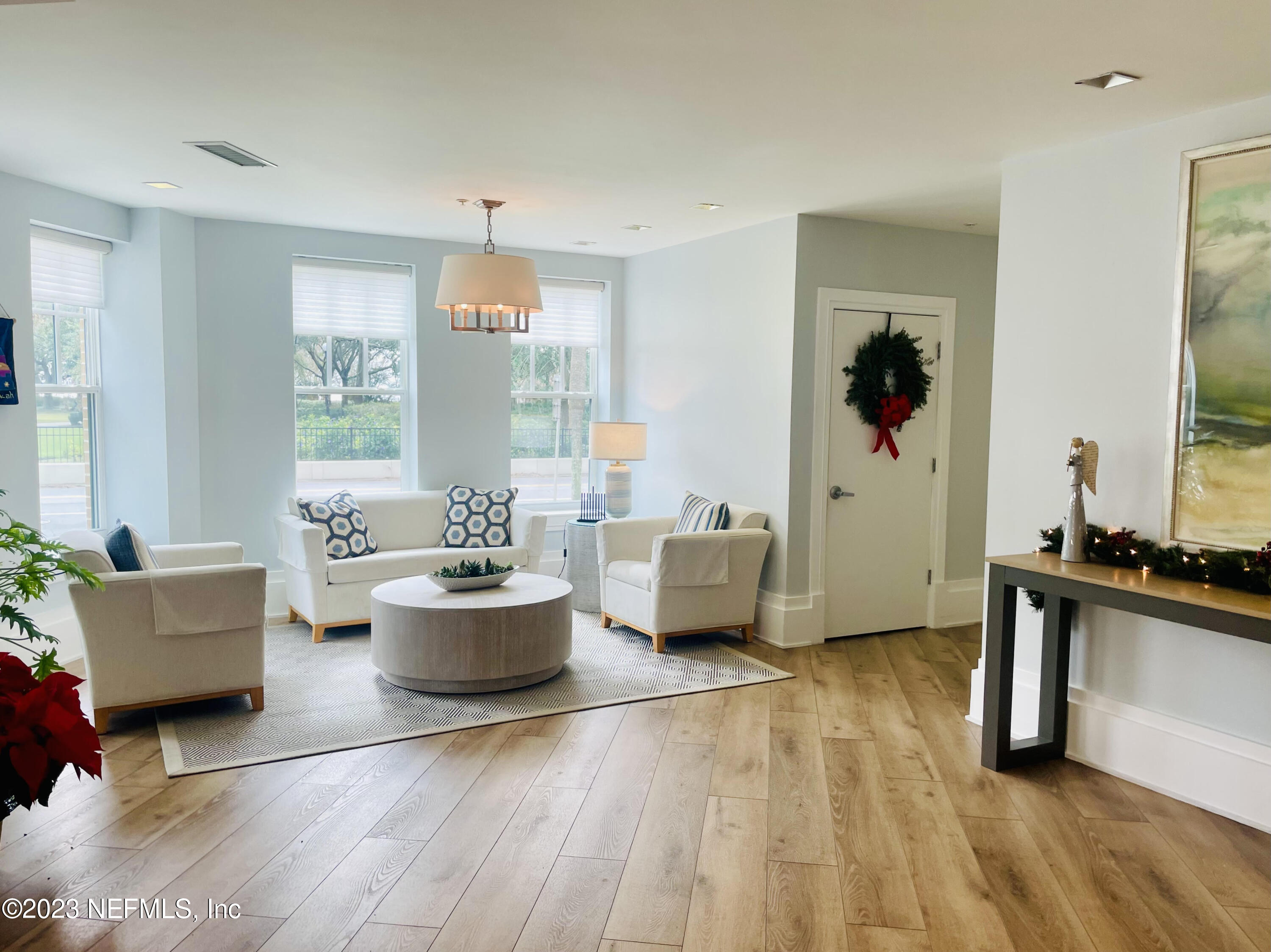 1661 Riverside Avenue, Unit 119 Jacksonville, FL 32204 - Photo 42 of 45 a living room with furniture and a potted plant