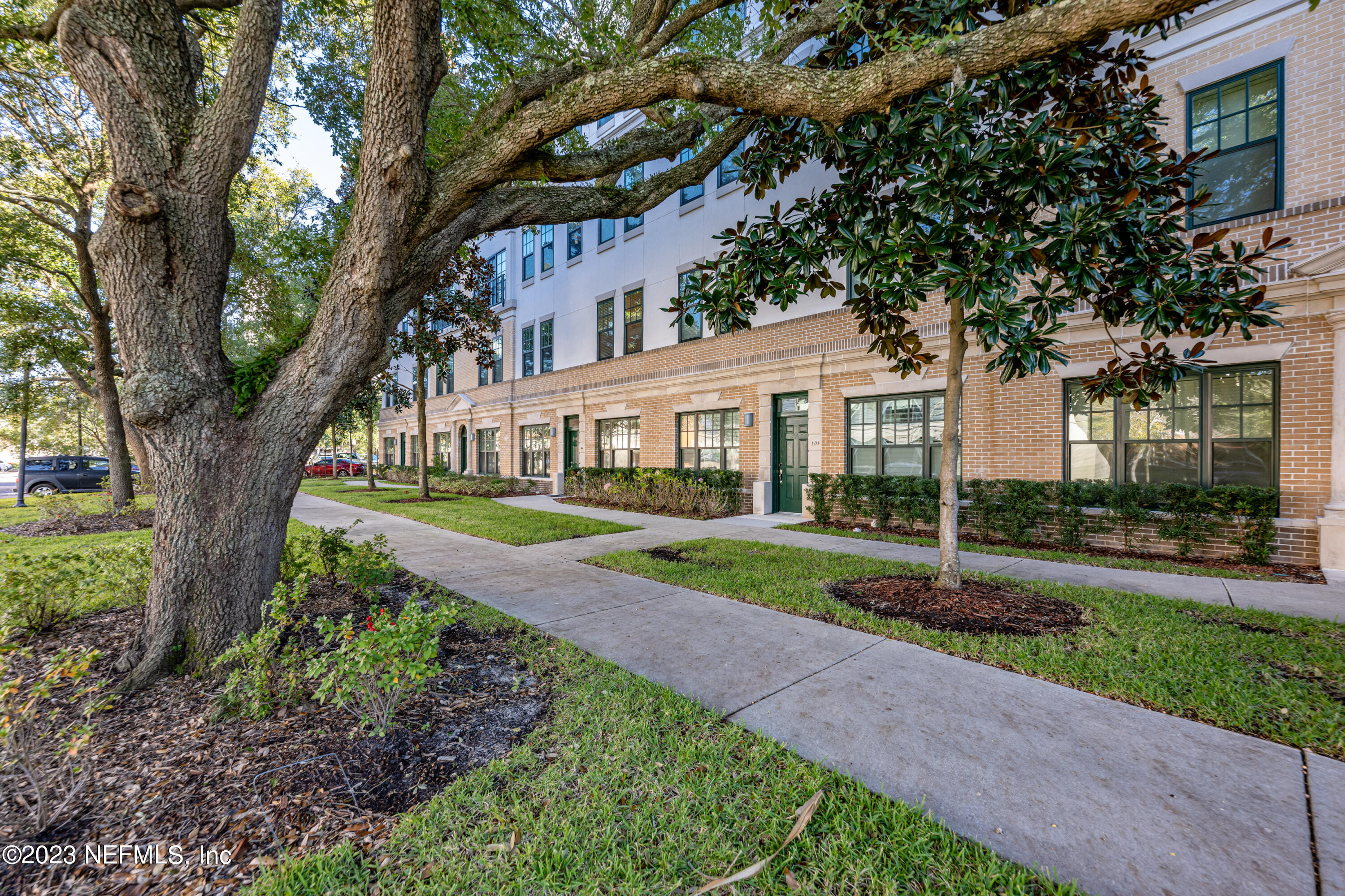 1661 Riverside Avenue, Unit 119 Jacksonville, FL 32204 - Photo 45 of 45 a white house that has a tree in front of it