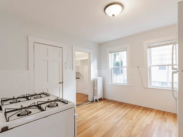 a view of a livingroom with furniture and wooden floor
