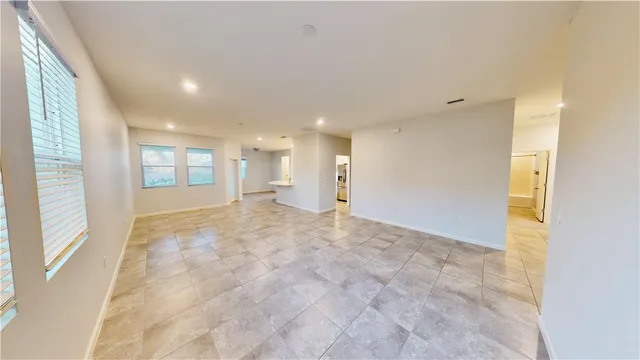 a view of an empty room and window
